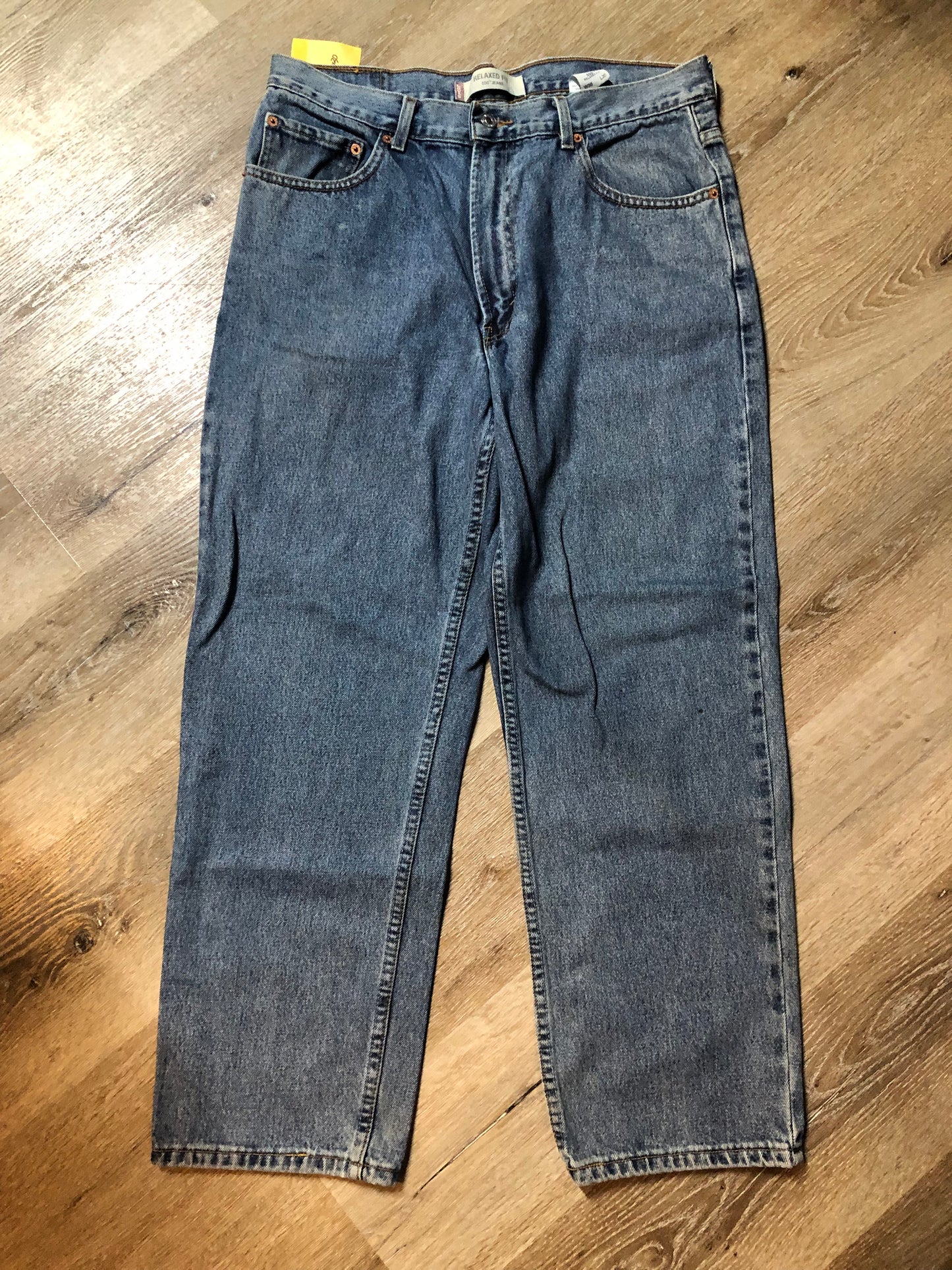 Levi’s 550 - 36”x30” Denim Jeans Relaxed fit Red tab High rise Button fly Tapered leg Lighter wash 100% cotton Made in Egypt - Kingspier Vintage