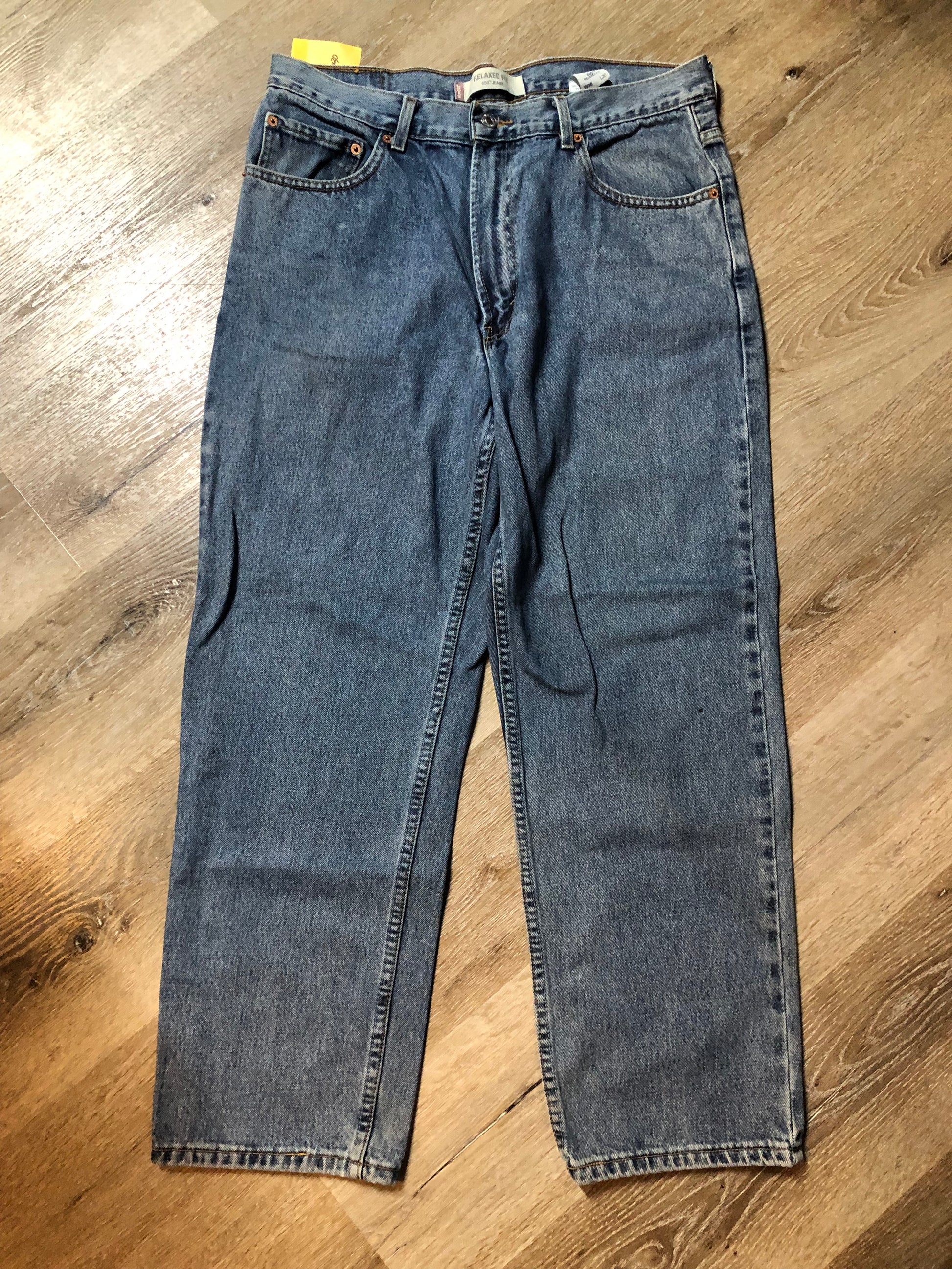 Levi’s 550 - 36”x30” Denim Jeans  Relaxed fit  Red tab  High rise  Button fly  Tapered leg  Lighter wash  100% cotton  Made in Egypt - Kingspier Vintage
