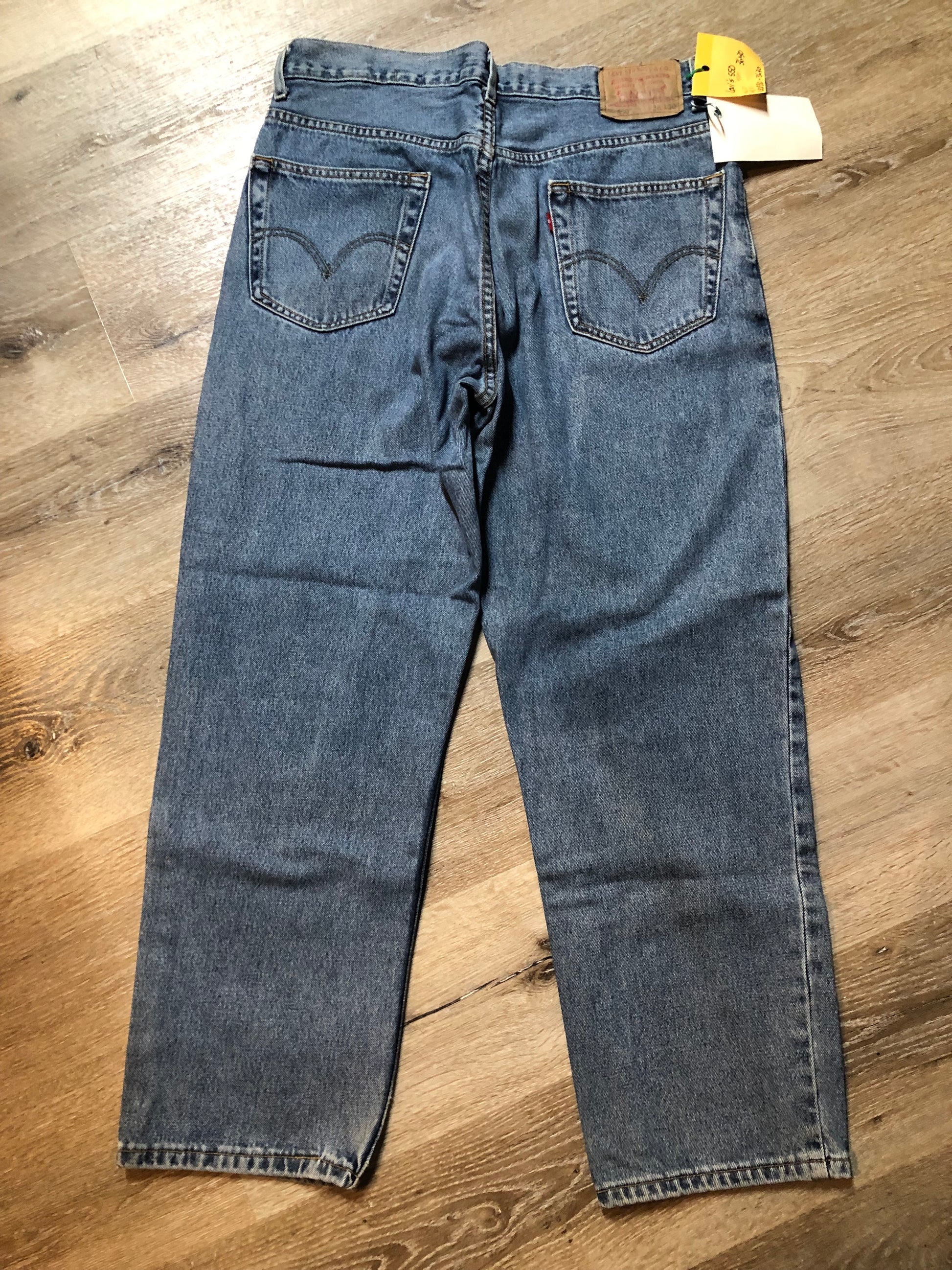 Levi’s 550 - 36”x30” Denim Jeans  Relaxed fit  Red tab  High rise  Button fly  Tapered leg  Lighter wash  100% cotton  Made in Egypt - Kingspier Vintage