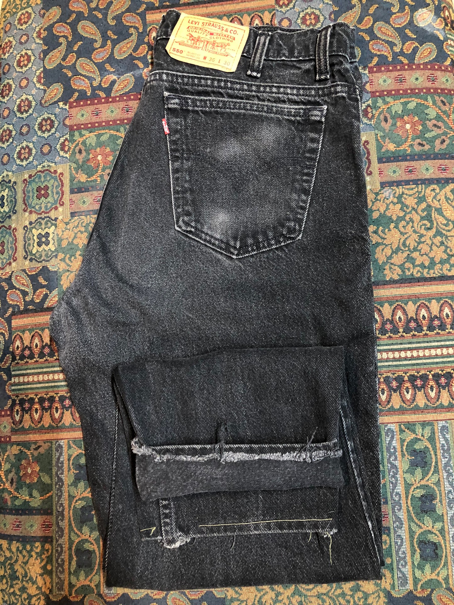 Levi’s 550 - 36”x28” Black Denim Jeans Vintage Red Tab High rise Button fly Tapered leg Tagged 36”x30” 100% Cotton Button stamped “217” Made in Canada - Kingspier Vintage