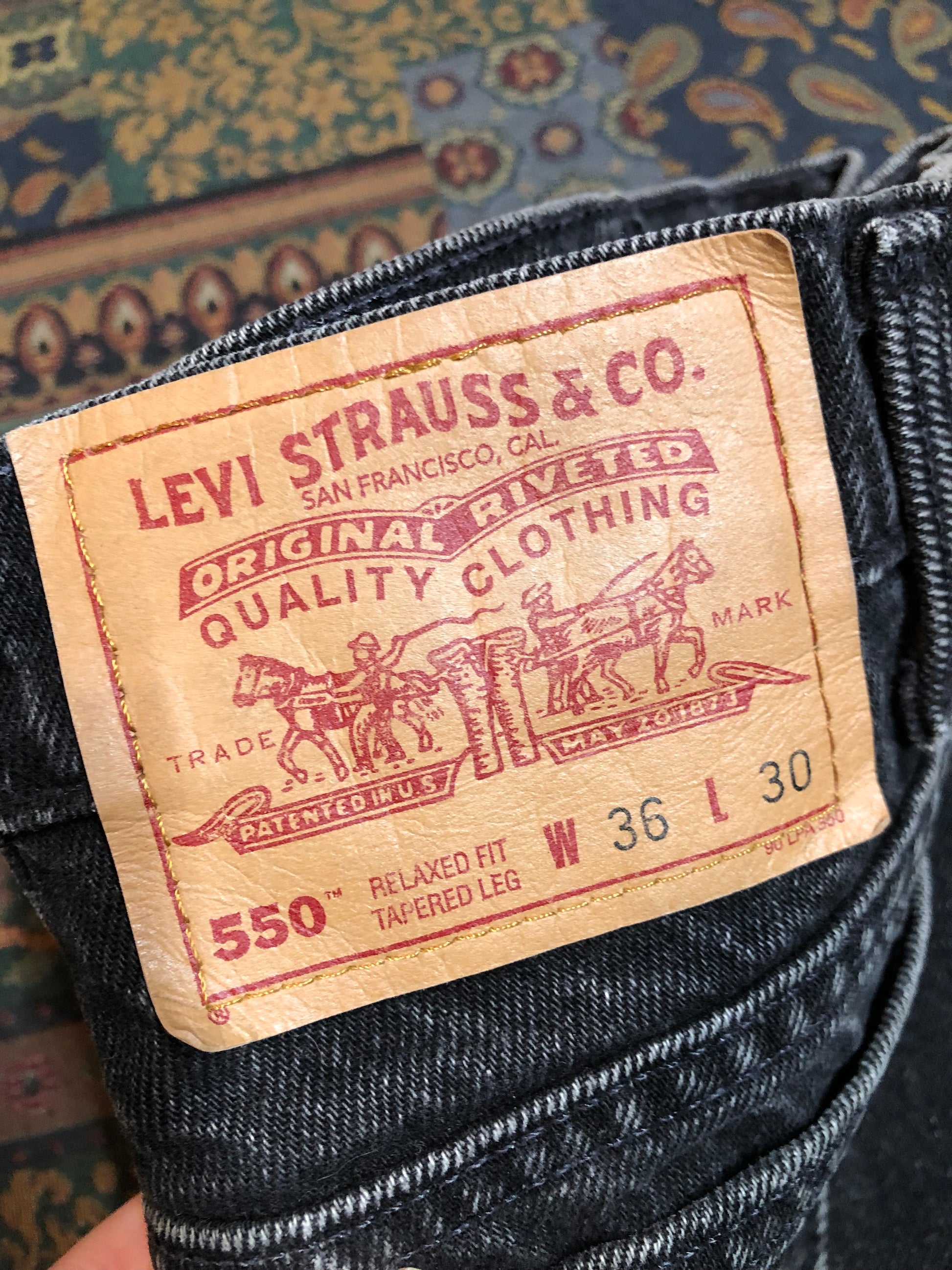 Levi’s 550 - 36”x28” Black Denim Jeans  Vintage Red Tab  High rise  Button fly  Tapered leg  Tagged 36”x30”  100% Cotton  Button stamped “217”  Made in Canada - Kingspier Vintage