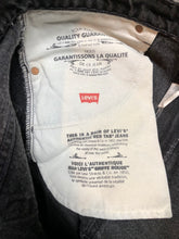 Load image into Gallery viewer, Levi’s 550 - 36”x28” Black Denim Jeans  Vintage Red Tab  High rise  Button fly  Tapered leg  Tagged 36”x30”  100% Cotton  Button stamped “217”  Made in Canada - Kingspier Vintage
