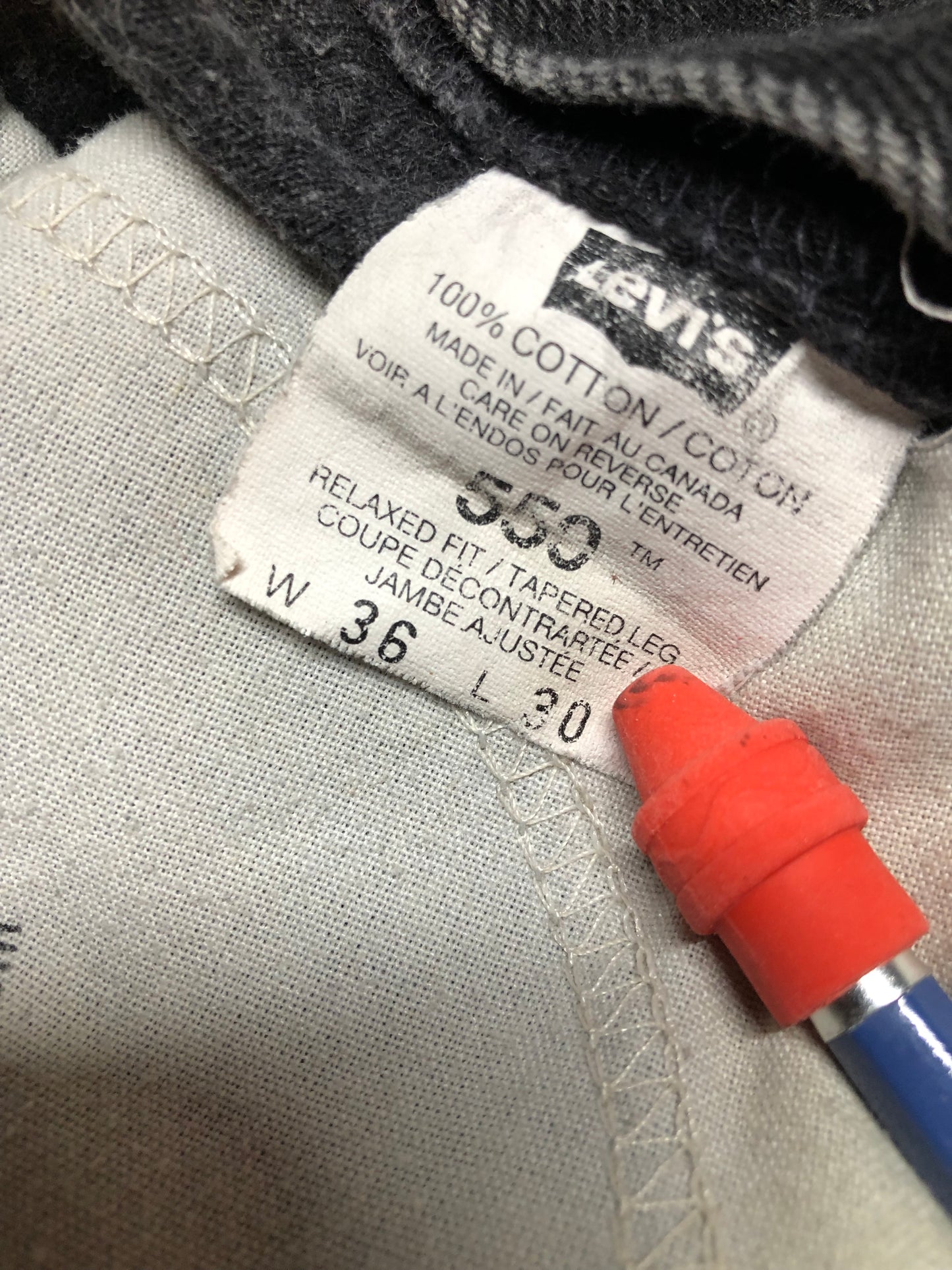 Levi’s 550 - 36”x28” Black Denim Jeans Vintage Red Tab High rise Button fly Tapered leg Tagged 36”x30” 100% Cotton Button stamped “217” Made in Canada - Kingspier Vintage