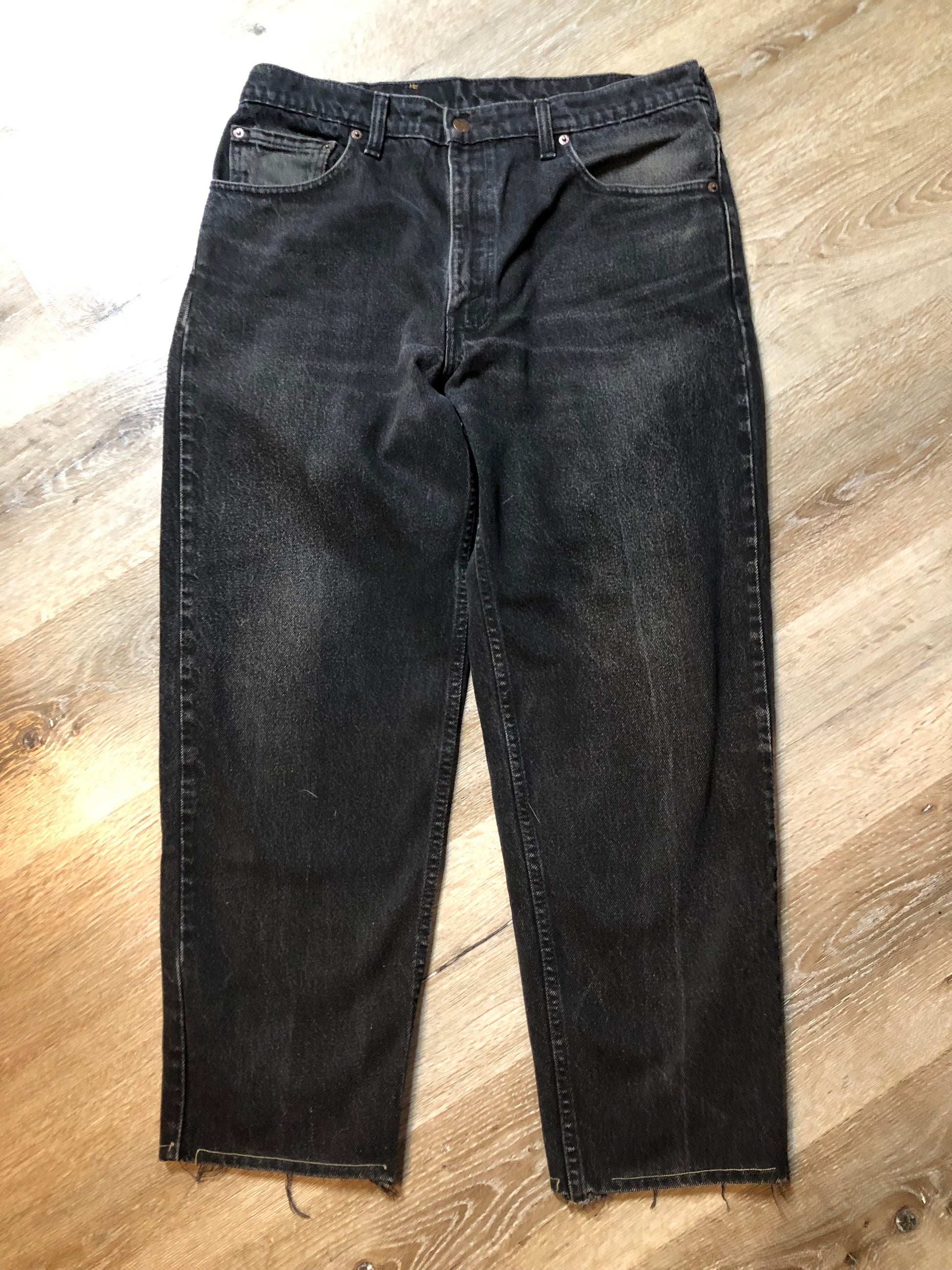 Levi’s 550 - 36”x28” Black Denim Jeans  Vintage Red Tab  High rise  Button fly  Tapered leg  Tagged 36”x30”  100% Cotton  Button stamped “217”  Made in Canada - Kingspier Vintage