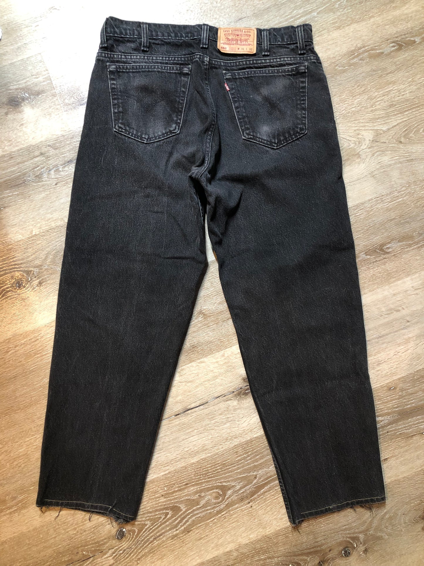 Levi’s 550 - 36”x28” Black Denim Jeans Vintage Red Tab High rise Button fly Tapered leg Tagged 36”x30” 100% Cotton Button stamped “217” Made in Canada - Kingspier Vintage