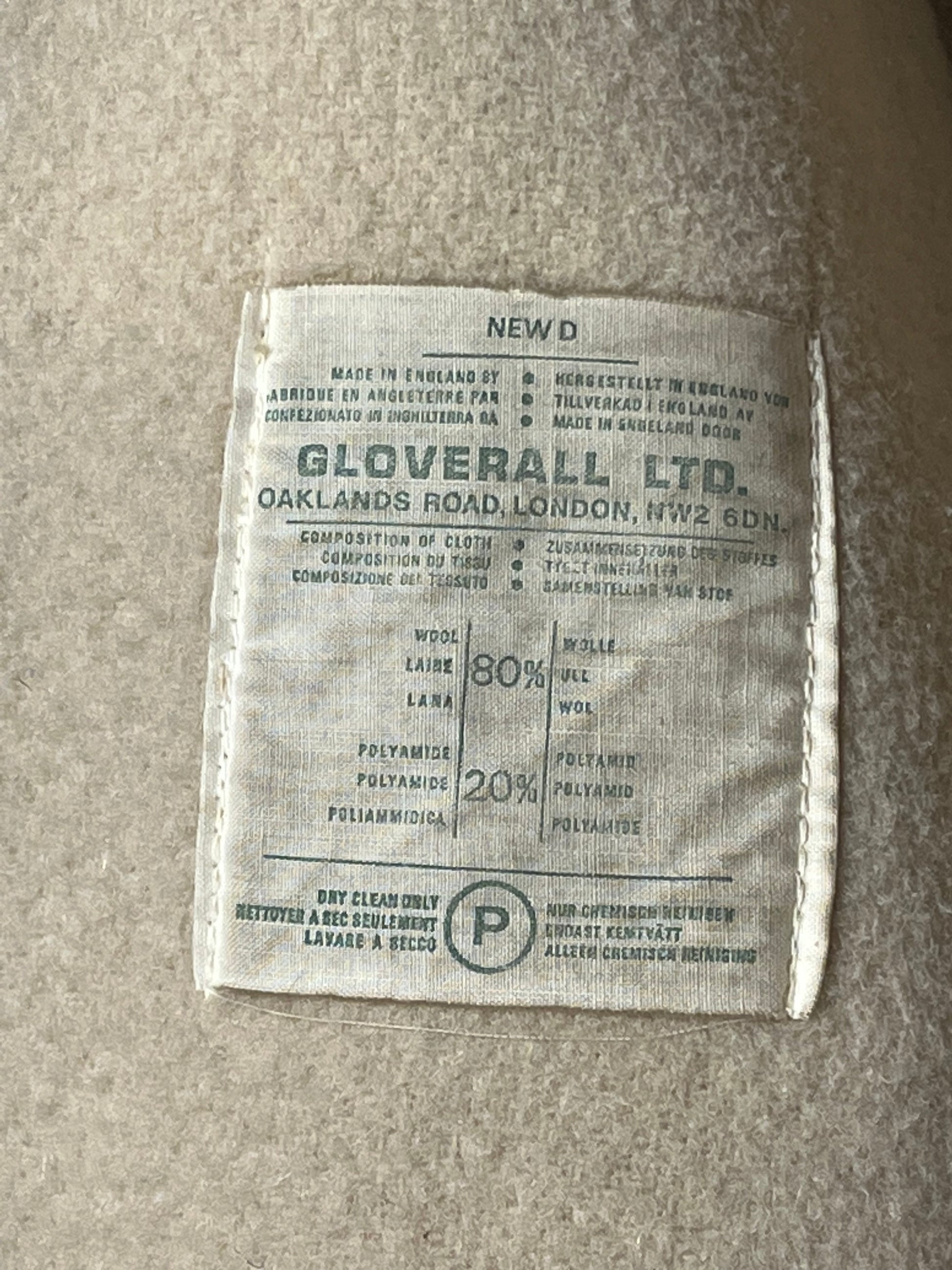 Vintage Gloverall tan duffle coat, with zipper and horn toggle closures, hood and two flap pockets.
80% wool/ 20% polyester
Made in England
Size 52
