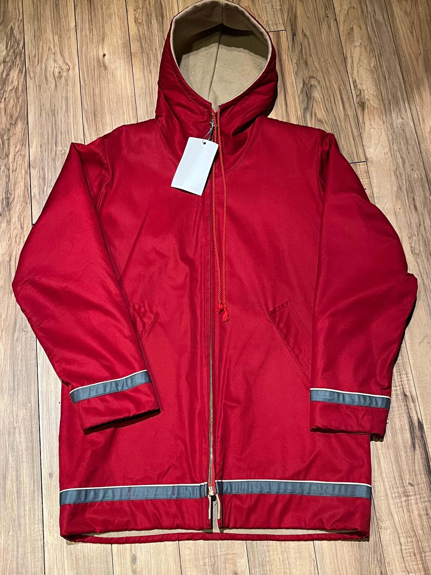 Vintage red northern parka with cotton shell, wool lining, zipper closure and two front pockets.
Chest 44”