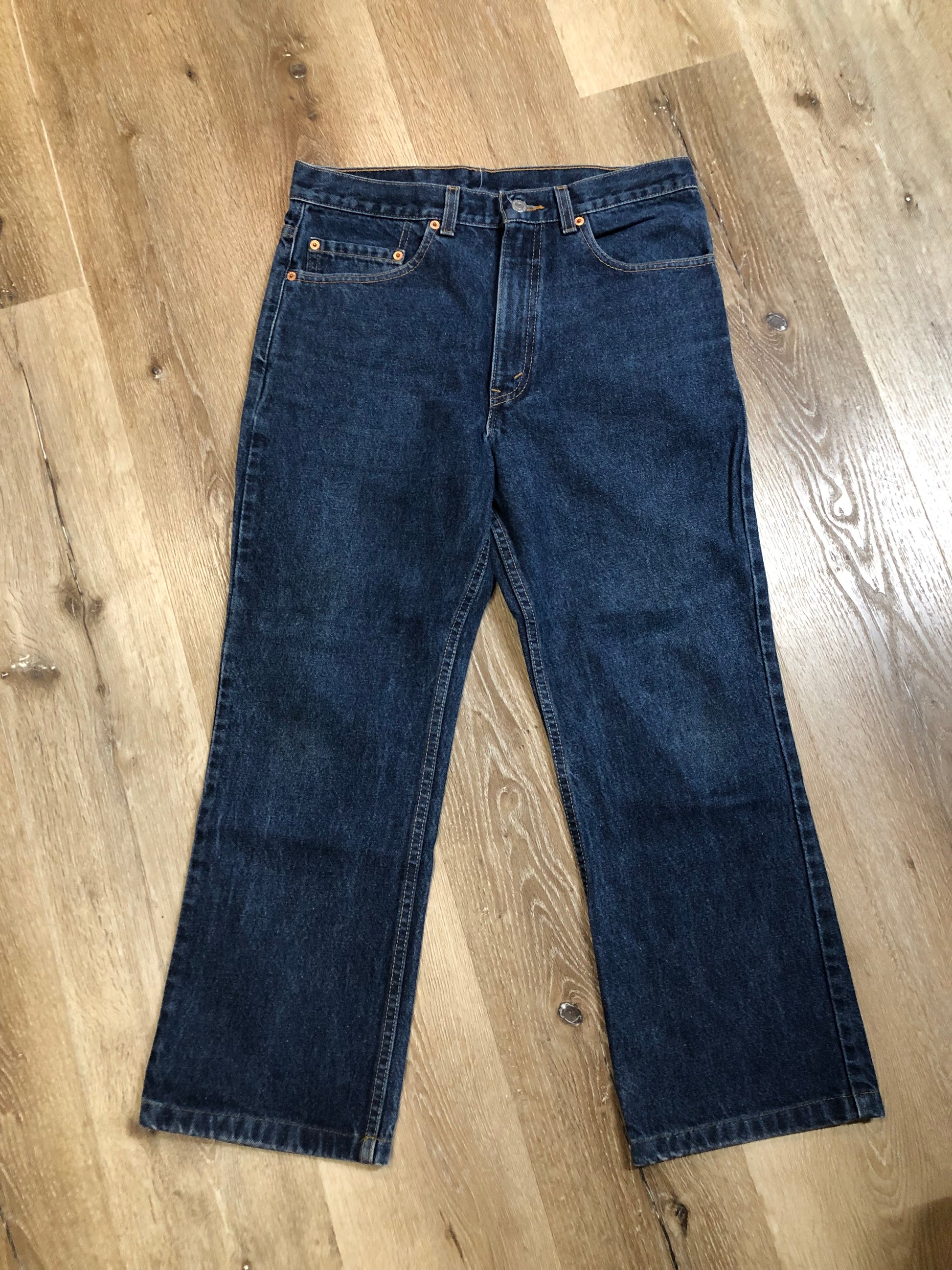 Levi’s 517 Denim Jeans - 33”x26.5”  Vintage Red Tab  High rise  Zip fly  Boot cut leg  100% Cotton  Medium Wash  Button stamp “512”  Tagged at 33x34 Professionally hemmed at 26,5”  Made in USA - Kingspier Vintage