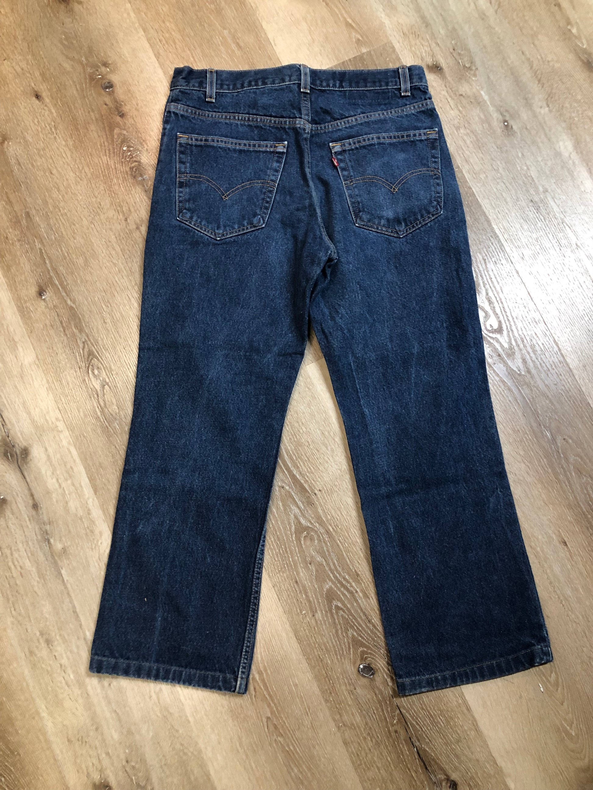 Levi’s 517 Denim Jeans - 33”x26.5”  Vintage Red Tab  High rise  Zip fly  Boot cut leg  100% Cotton  Medium Wash  Button stamp “512”  Tagged at 33x34 Professionally hemmed at 26,5”  Made in USA - Kingspier Vintage