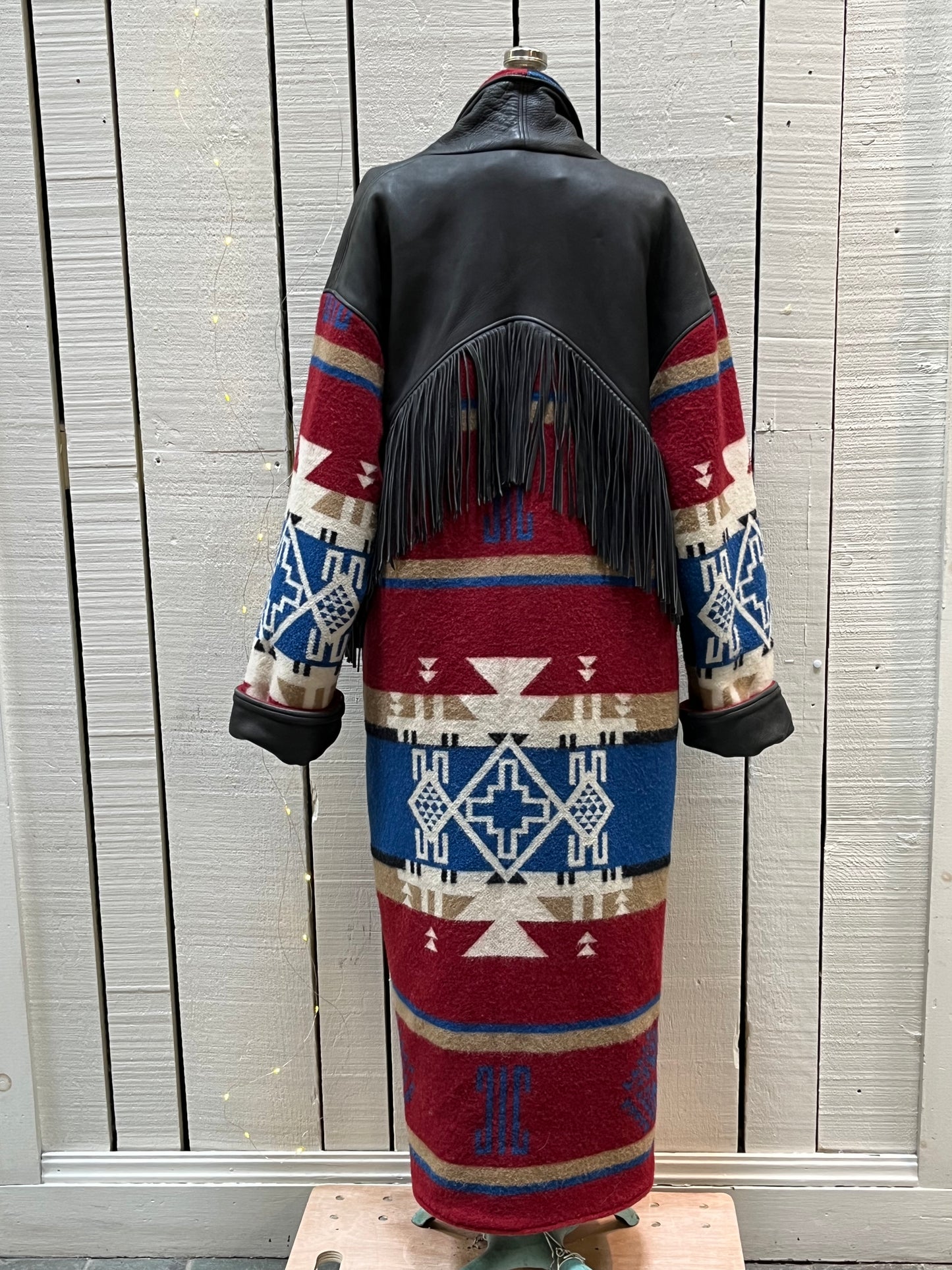 Vintage TA Branded Santa Fe/ Southwest style wool coat with deerskin fringe, leather cuffs and natural horn buttons.