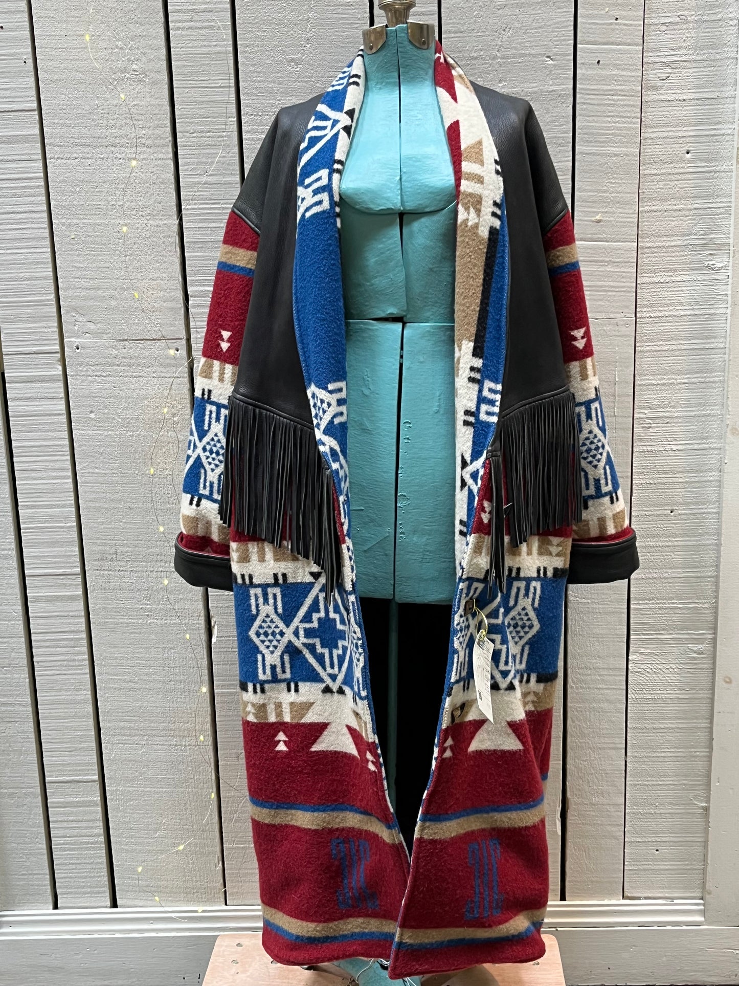 Vintage TA Branded Santa Fe/ Southwest style wool coat with deerskin fringe, leather cuffs and natural horn buttons.