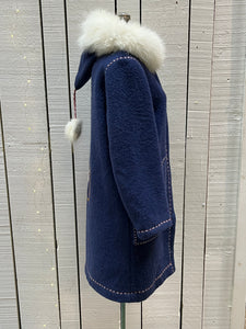 Vintage blue wool northern parka with zipper closures, two patch pockets, white fur trimmed hood, hand embroidered flower details and an embroidered bird on the back. 

Chest 42”