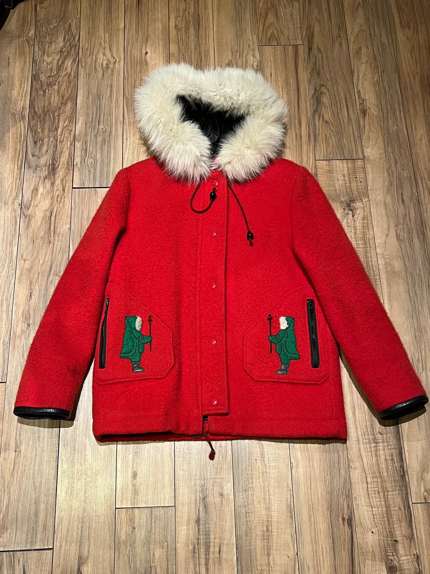 Vintage James Bay 100% pure virgin wool red northern parka with white fur trimmed hood, zipper and snap closures, two zip front pockets, drawstring at the waist, leather trimmed cuffs, a quilted lining and felt applique details.
Made in Canada
Chest 40”