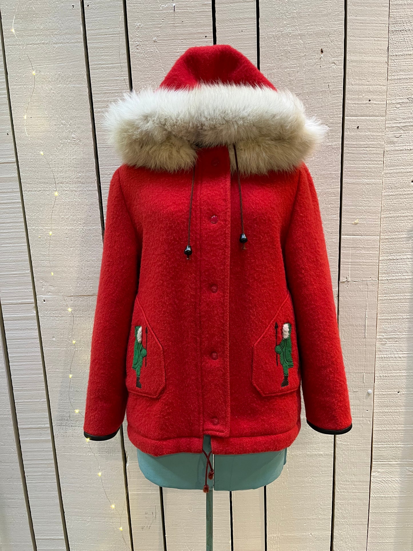 Vintage James Bay 100% pure virgin wool red northern parka with white fur trimmed hood, zipper and snap closures, two zip front pockets, drawstring at the waist, leather trimmed cuffs, a quilted lining and felt applique details.
Made in Canada
Chest 40”