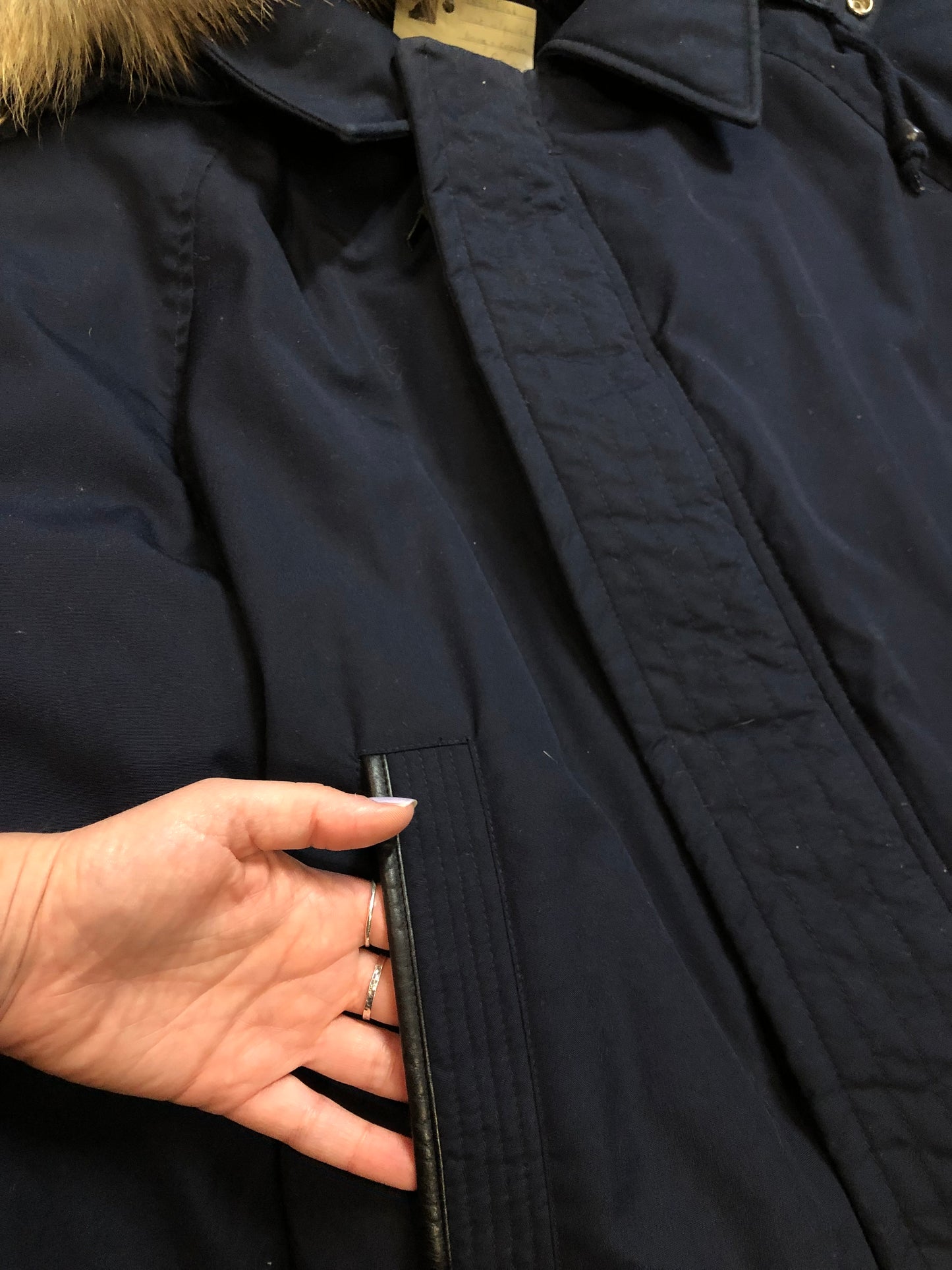 Kingspier Vintage - Vintage down filled cold weather parka in black with no labels.
This parka features a hood with coyote fur trim, quilted lining, storm cuffs, hand warmer pockets and flap pockets, zipper closure, polyester/ cotton shell with 60% down/ 40% waterfowl feather fill.
Made in Korea.
Size 42.