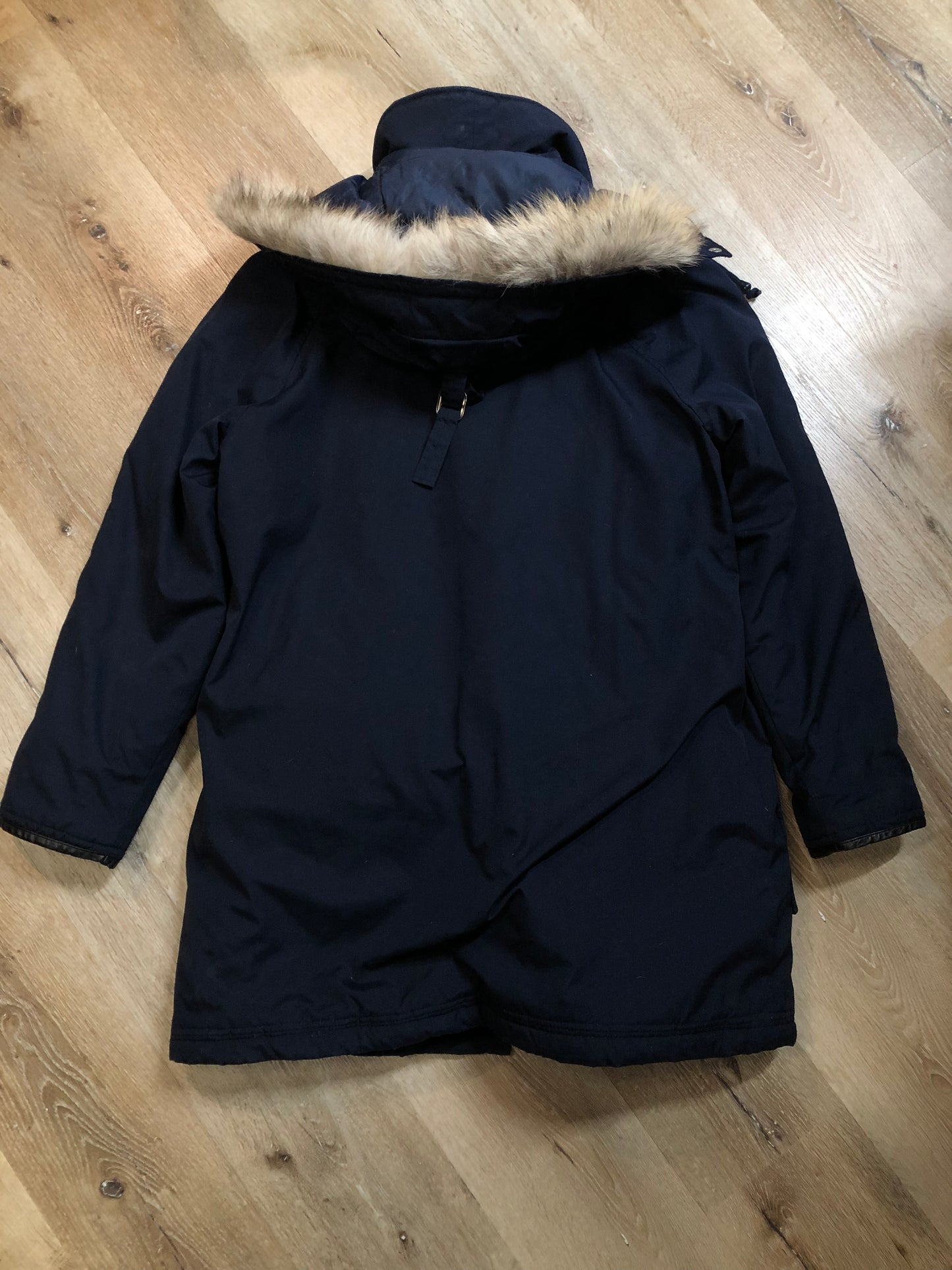 Kingspier Vintage - Vintage down filled cold weather parka in black with no labels.
This parka features a hood with coyote fur trim, quilted lining, storm cuffs, hand warmer pockets and flap pockets, zipper closure, polyester/ cotton shell with 60% down/ 40% waterfowl feather fill.
Made in Korea.
Size 42.