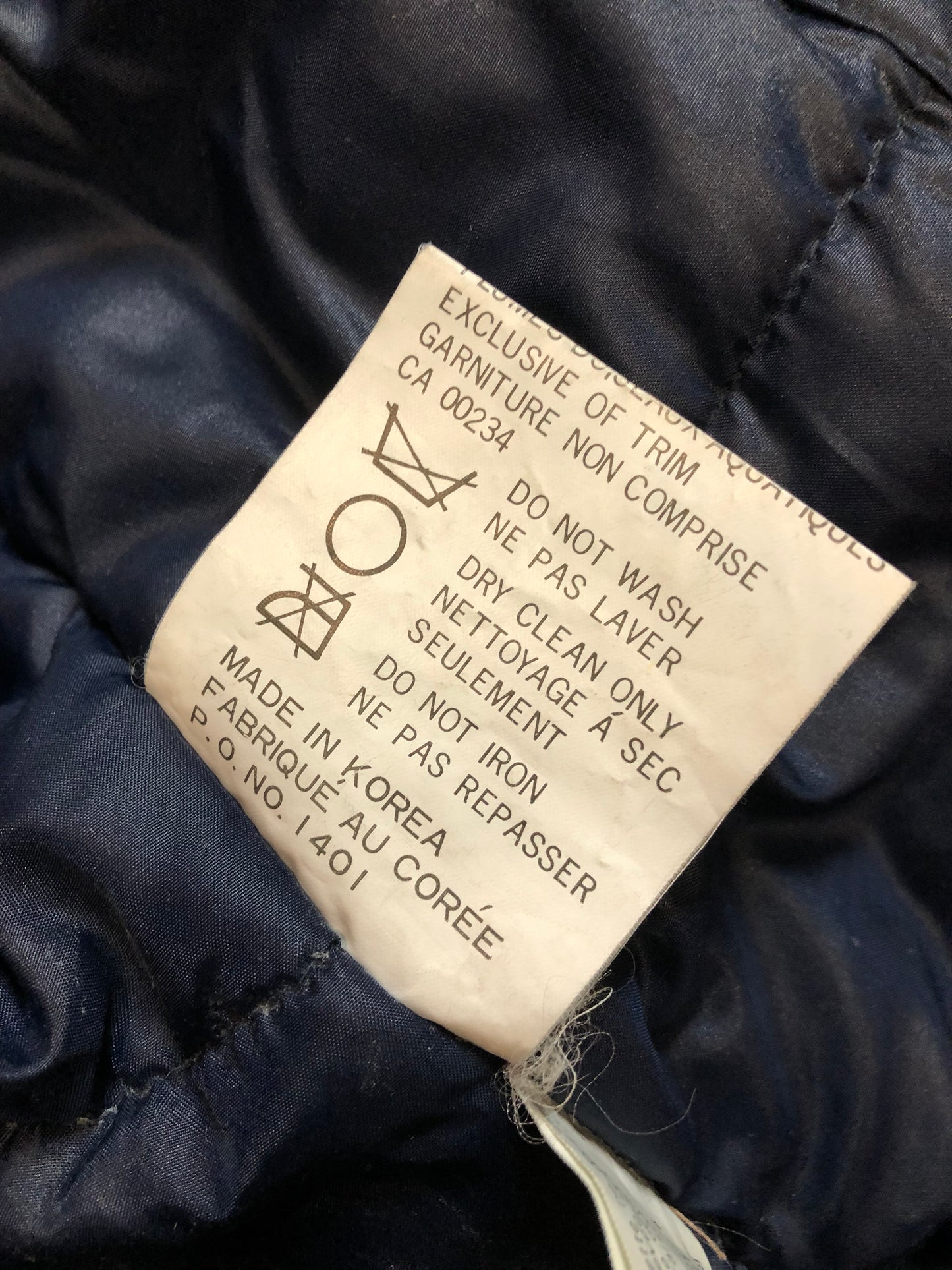 Kingspier Vintage - Vintage down filled cold weather parka in black with no labels.
This parka features a hood with coyote fur trim, quilted lining, storm cuffs, hand warmer pockets and flap pockets, zipper closure, polyester/ cotton shell with 60% down/ 40% waterfowl feather fill.
Made in Korea.
Size 42.