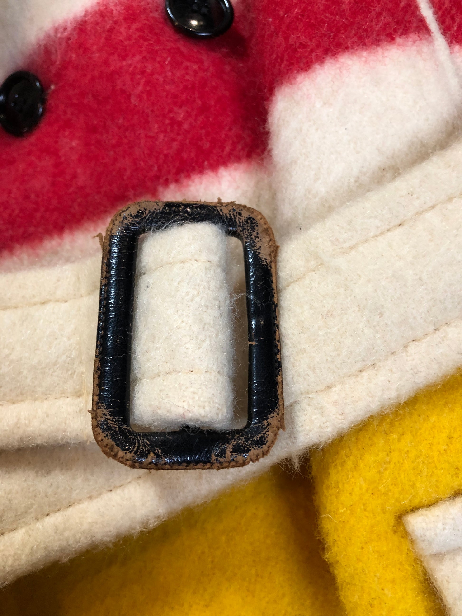 Kingspier Vintage - Genuine Hudson’s Bay Company point blanket coat in the iconic multistripe colours. The coat features flap pockets and hand warmer pockets, double breasted button closures and belt. Made in Canada. Men’s size 46.