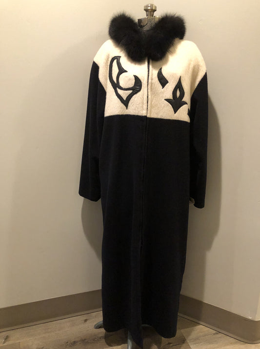 Kingspier Vintage - Linda Lundstrom full length black and white wool coat with fur hood, soft leather applique on the chest and back, zipper closures and a black satin like lining. Made in Canada.