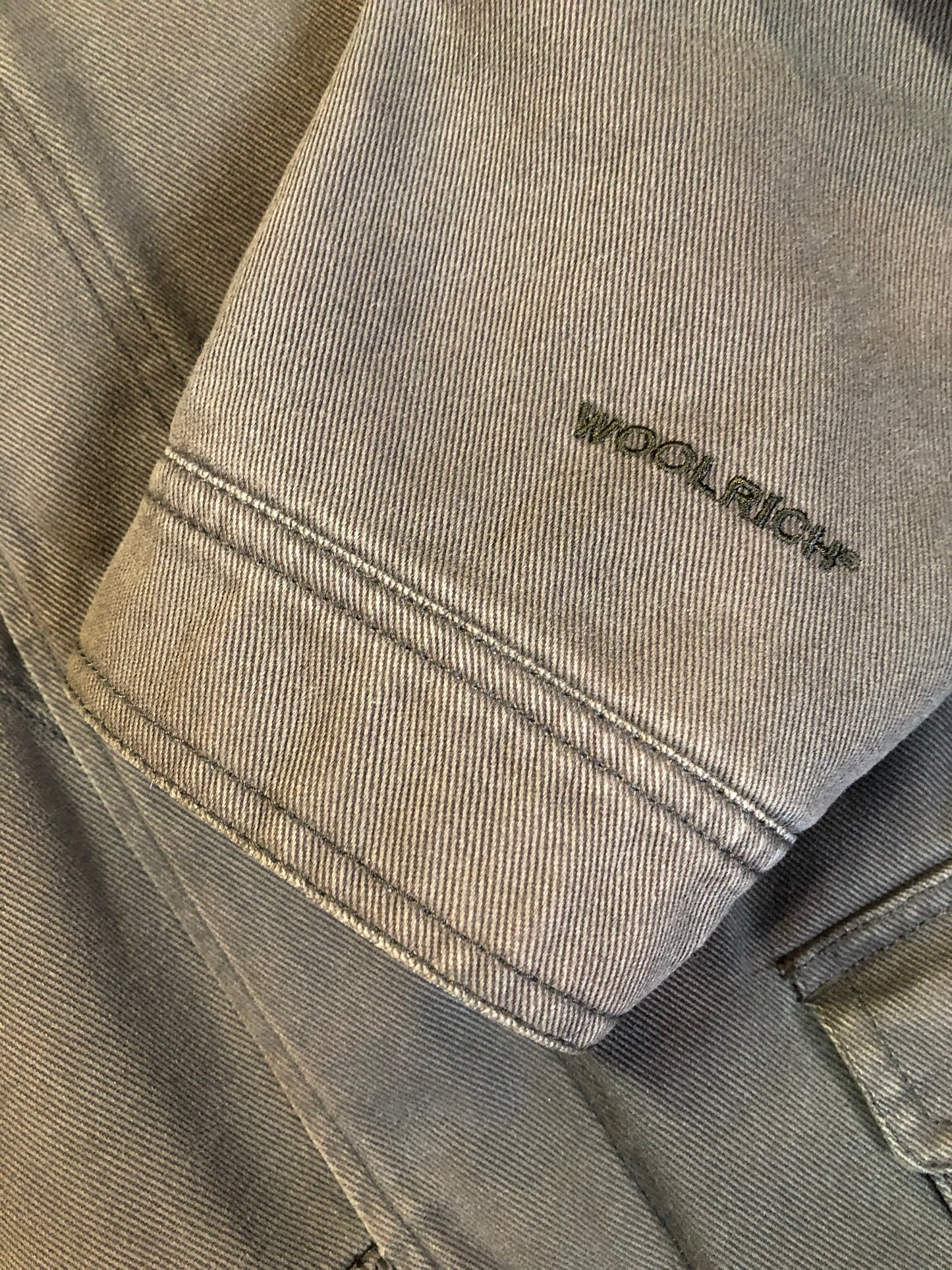 Kingspier Vintage - Woolrich olive green chore jacket features suede collar, flap pockets, hand warmer pockets, zipper and button closures, inside autumn colour striped fleece lining and inside pocket with pencil/ small tool holders. Men’s large.
