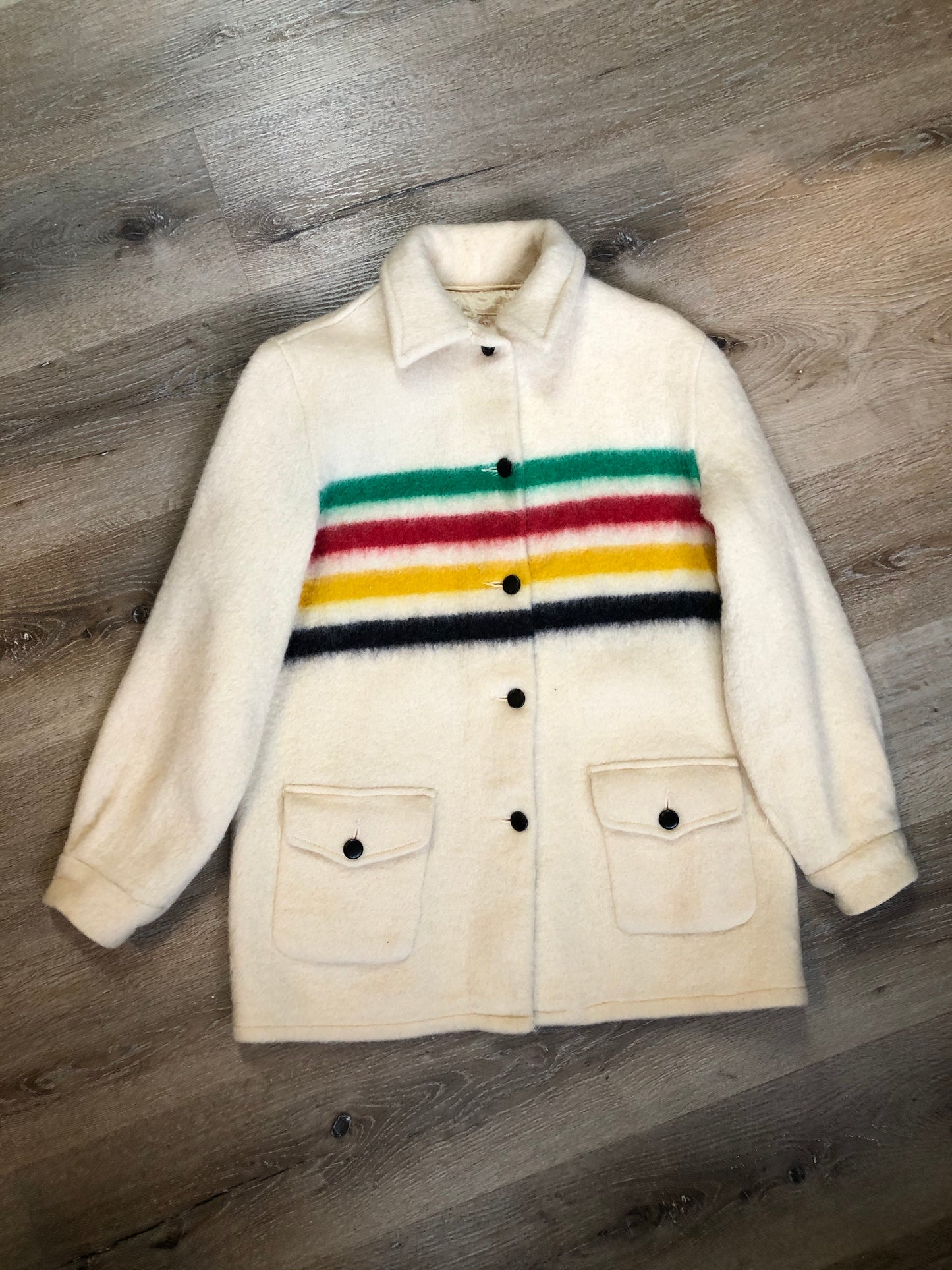 Kingspier Vintage - Vintage Hudson’s Bay Company point blanket jacket in iconic multi-stripe colours with flap pockets and button closures. Mens size small.