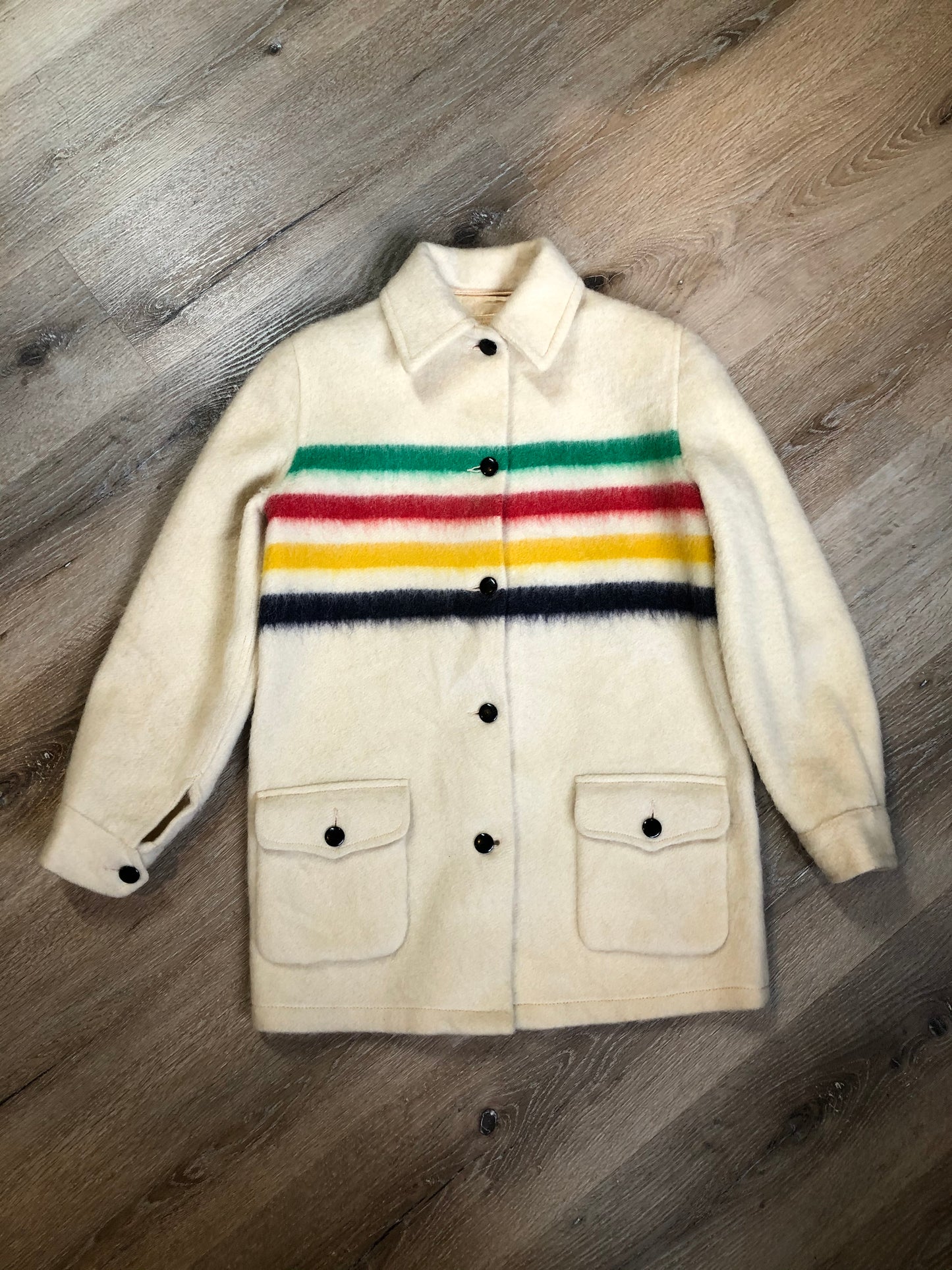Kingspier Vintage - Vintage Hudson’s Bay Company point blanket jacket in iconic multi-stripe colours with flap pockets and button closures. Mens size small.
