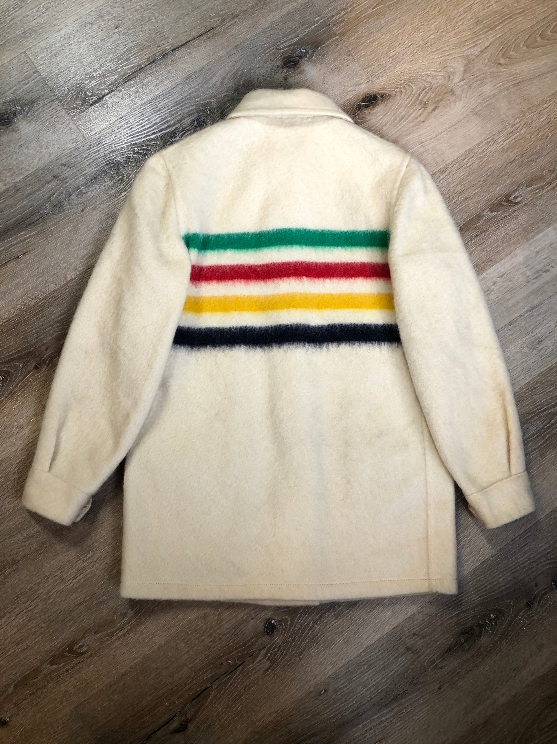 Kingspier Vintage - Vintage Hudson’s Bay Company point blanket jacket in iconic multi-stripe colours with flap pockets and button closures. Mens size small.