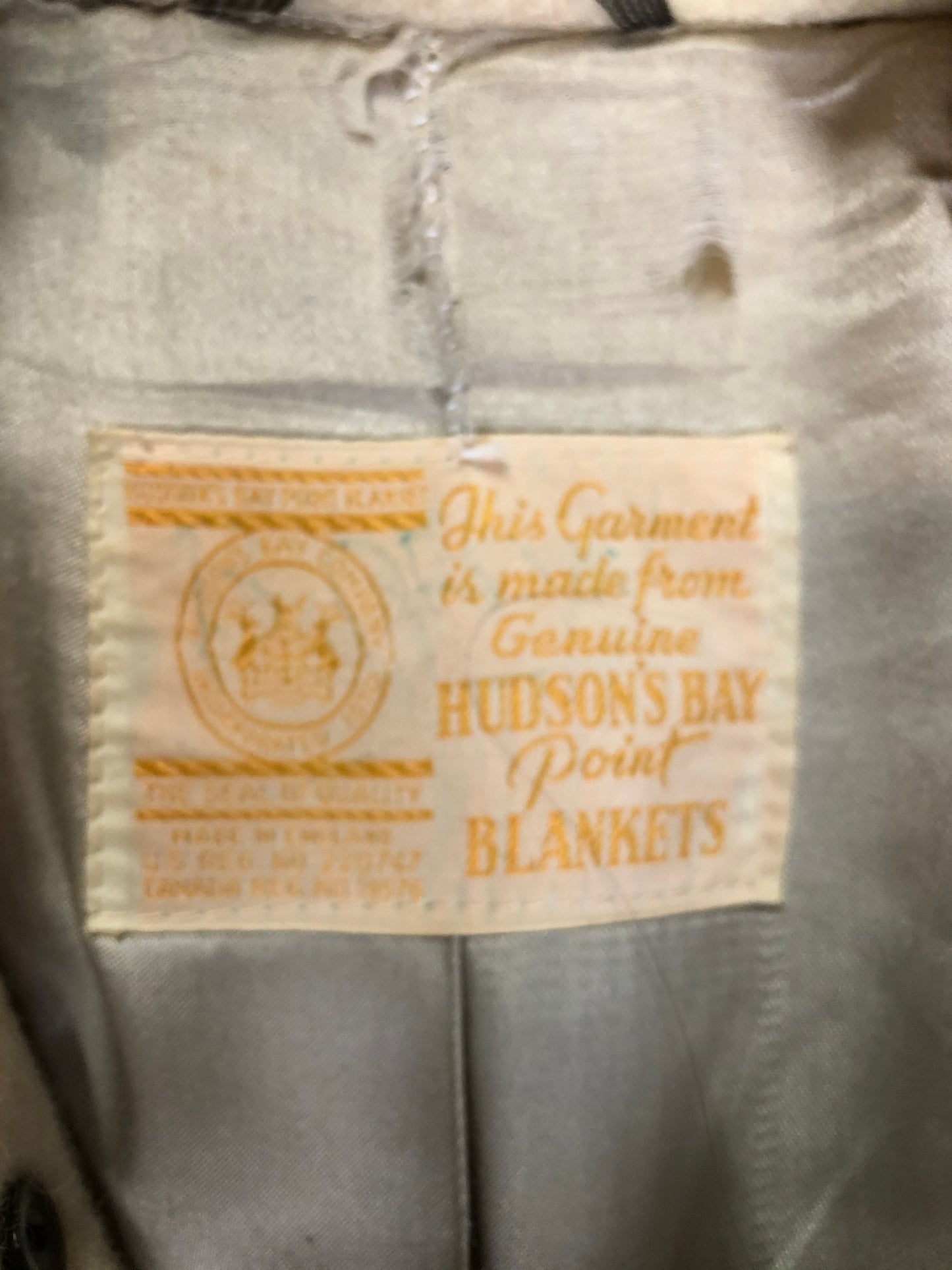 Kingspier Vintage - Genuine Hudson’s Bay Company point blanket coat in the iconic multi stripe colours. The coat features flap pockets and hand warmer pockets, double breasted button closures and belt. Made in Canada. Mens size 50.