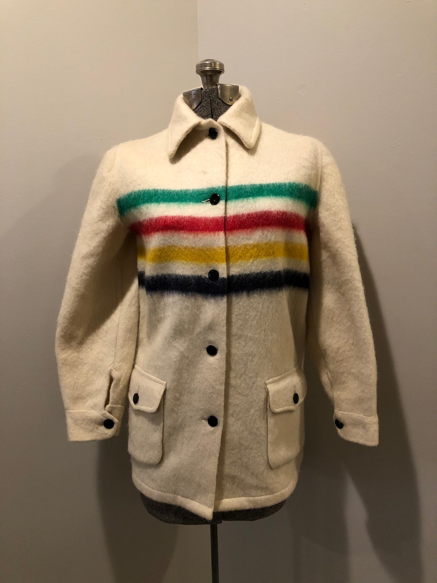 Kingspier Vintage - Vintage Hudson’s Bay Company point blanket jacket in iconic multi-stripe colours with flap pockets and button closures. Mens size small.