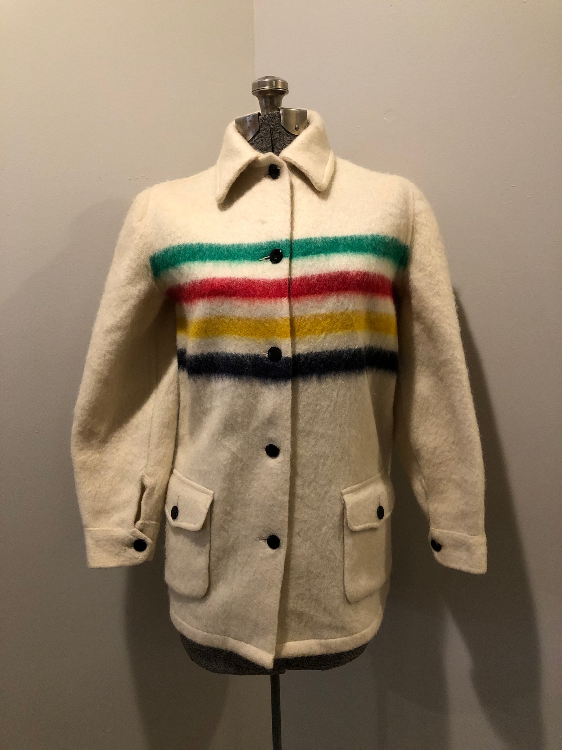 Kingspier Vintage - Vintage Hudson’s Bay Company point blanket jacket in iconic multi-stripe colours with flap pockets and button closures. Mens size small.