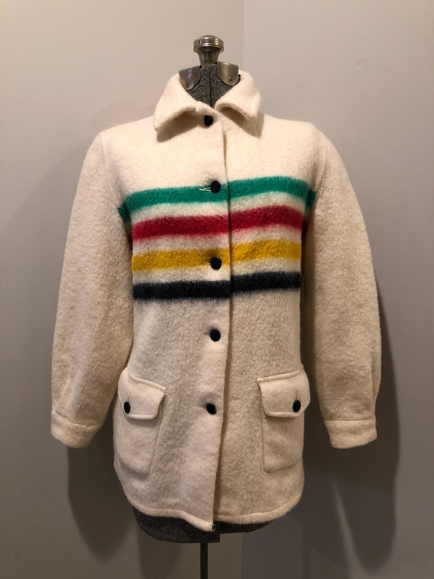 Kingspier Vintage - Vintage Hudson’s Bay Company point blanket jacket in iconic multi-stripe colours with flap pockets and button closures. Mens size small.