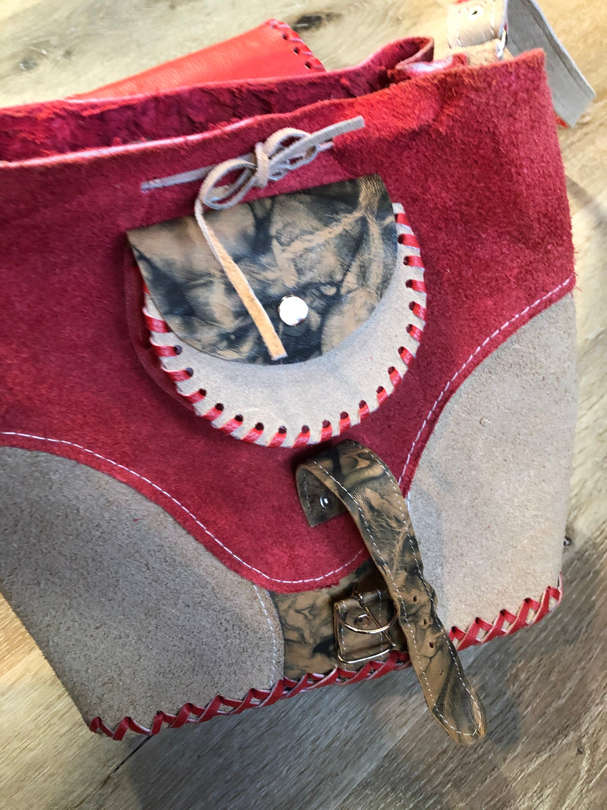 Kingspier Vintage - Tan and red saddle bag with red leather stitching, one large inside compartment and an adjustable shoulder strap.