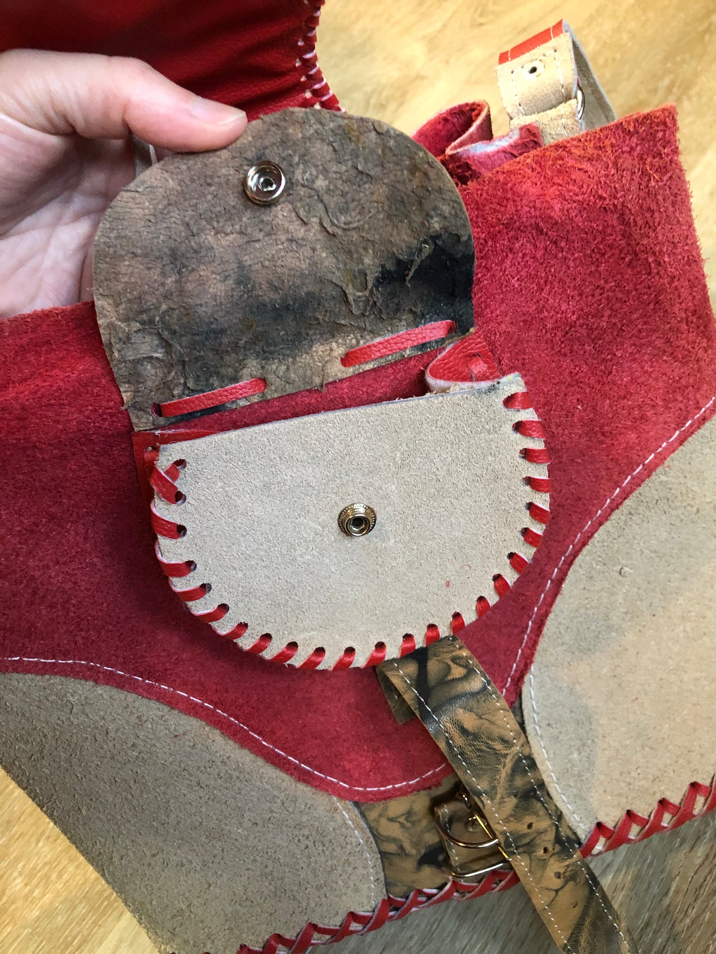 Kingspier Vintage - Tan and red saddle bag with red leather stitching, one large inside compartment and an adjustable shoulder strap.