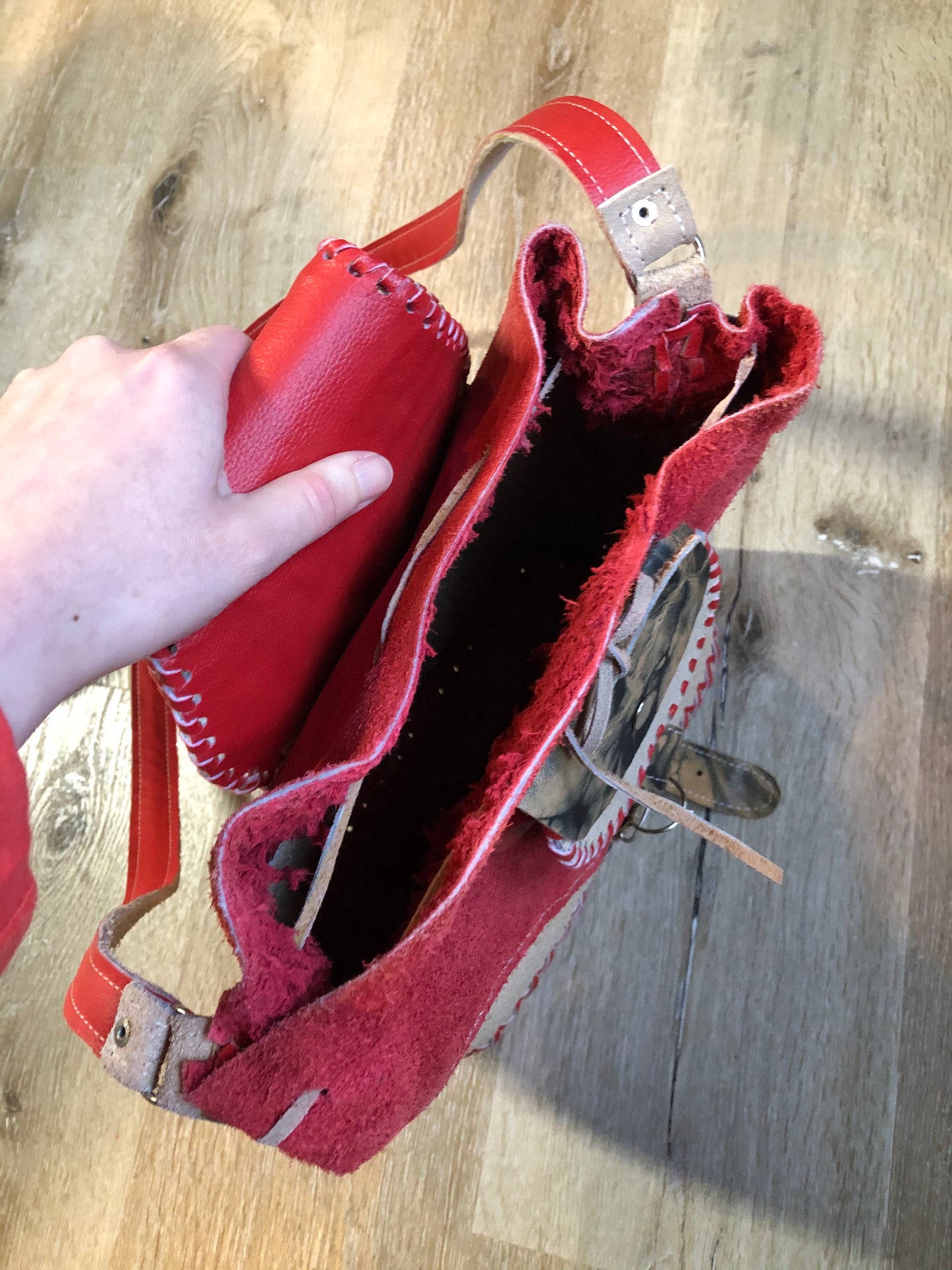 Kingspier Vintage - Tan and red saddle bag with red leather stitching, one large inside compartment and an adjustable shoulder strap.