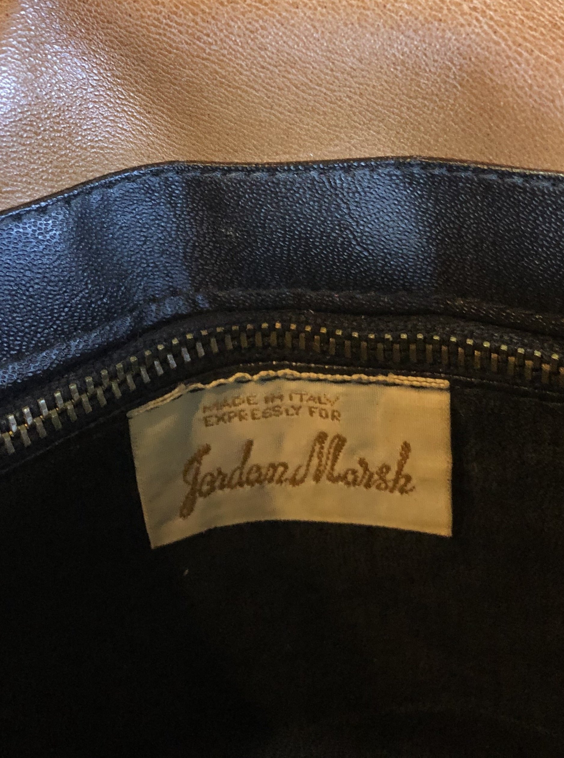 Kingspier Vintage - Jordan Marsh tan leather handbag with gold hardware and three inside compartments.