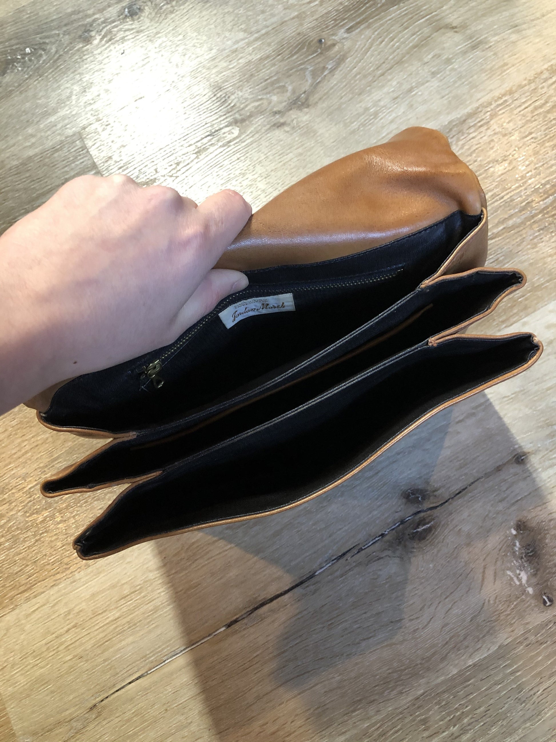 Kingspier Vintage - Jordan Marsh tan leather handbag with gold hardware and three inside compartments.