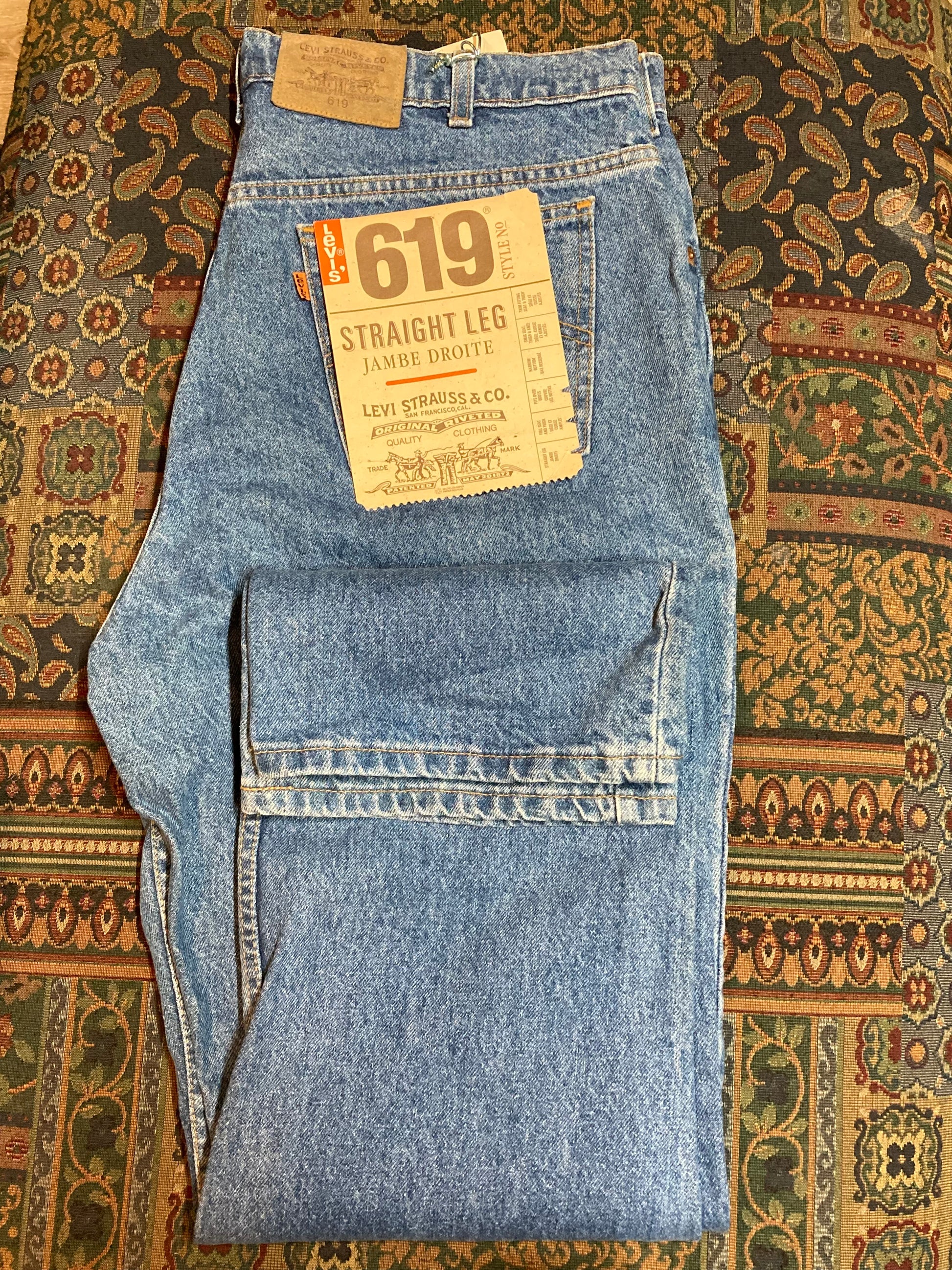Levi’s 619 Denim Jeans, new with tags  Vintage Deadstock  Orange Tab  High Waist  Straight leg  Labeled 38”x32”  Button stamped “C63”  Made in Canada - Kingspier Vintage