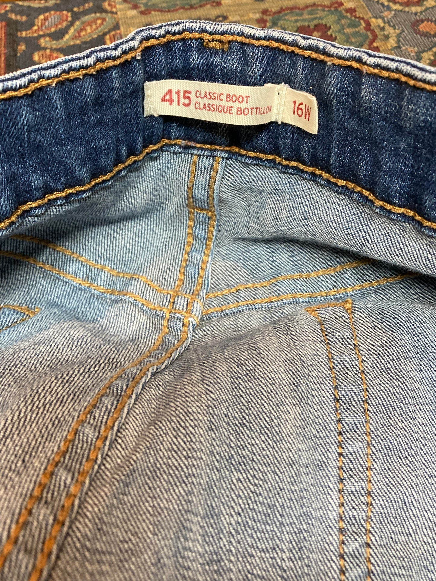 Levi’s 415 - Classic Boot Cut - 37”x30.5”, Size 16 Sits below waist Classic boot cut leg 99^ cotton/ 1% elastane Medium wash Made in Pakistan - Kingspier Vintage