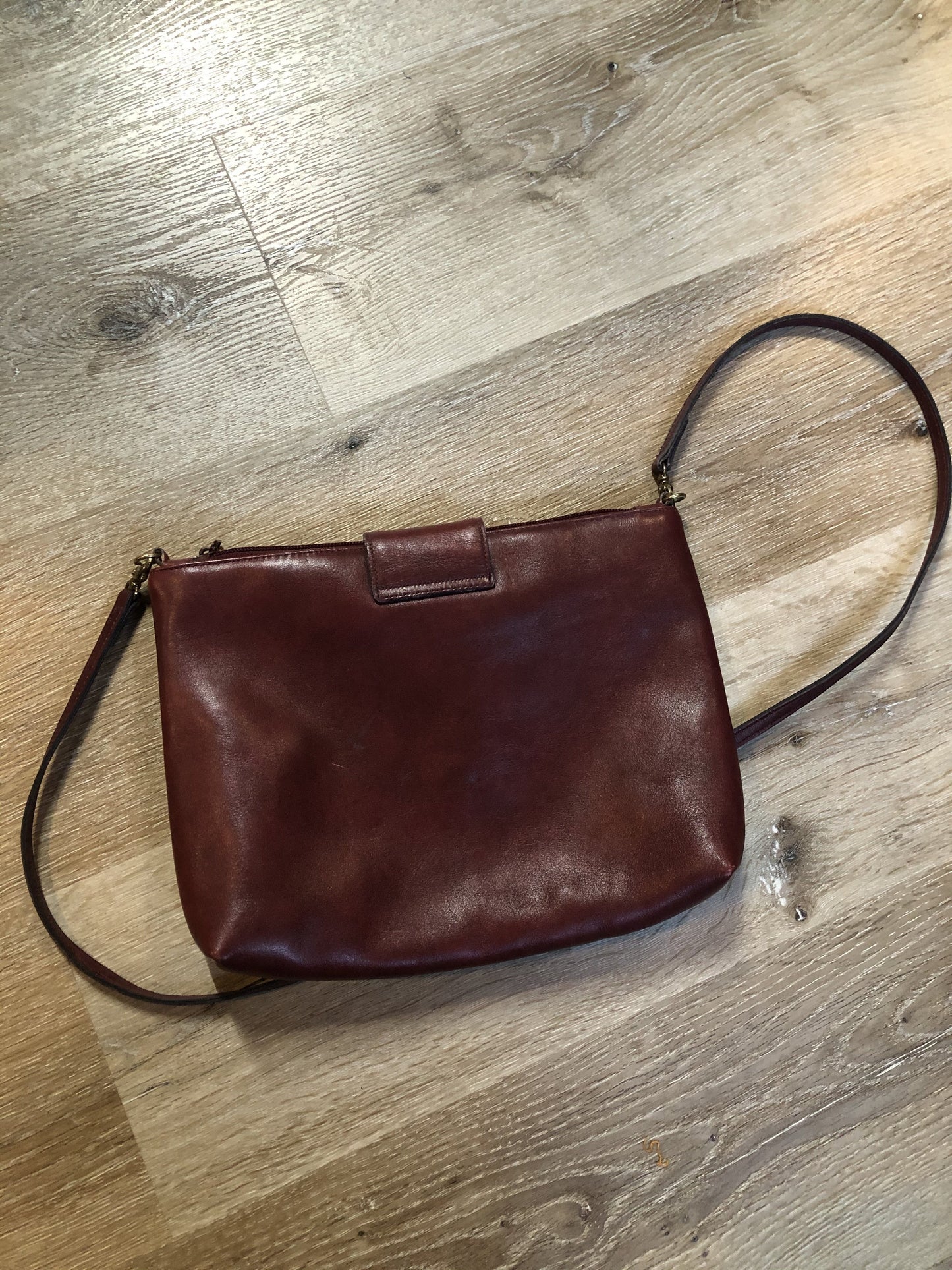 Kingspier Vintage - Etienne Aigner leather crossbody bag with brass hardware, zipper top closure and snap front closure.