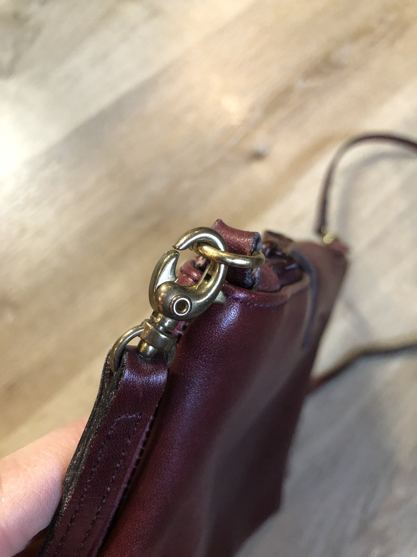 Kingspier Vintage - Etienne Aigner leather crossbody bag with brass hardware, zipper top closure and snap front closure.