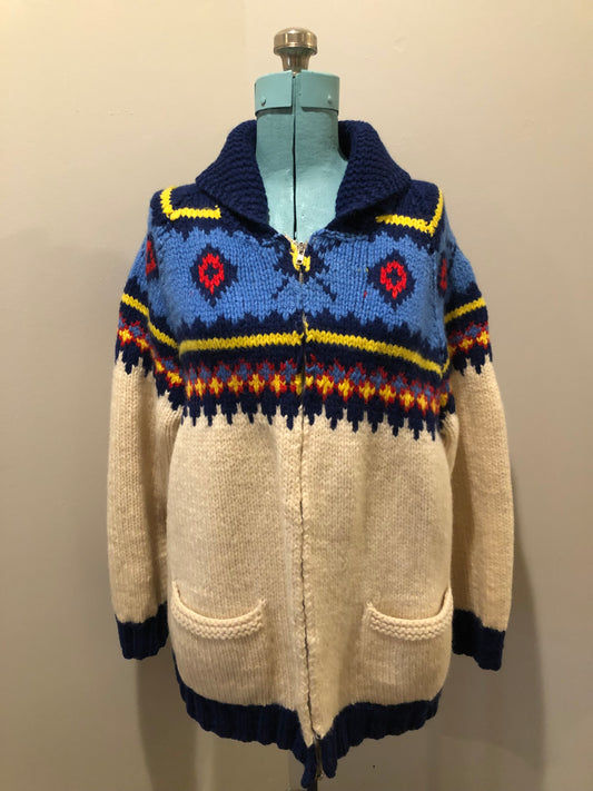 Kingspier Vintage - Vintage handmade Mary Maxim 100% wool cardigan features a vibrant cowichan style design, two front pockets and a zipper closure.
Made in Dartmouth, Nova scotia.
Size large.