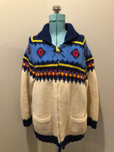 Load image into Gallery viewer, Kingspier Vintage - Vintage handmade Mary Maxim 100% wool cardigan features a vibrant cowichan style design, two front pockets and a zipper closure.

Made in Dartmouth, Nova scotia.
Size large.
