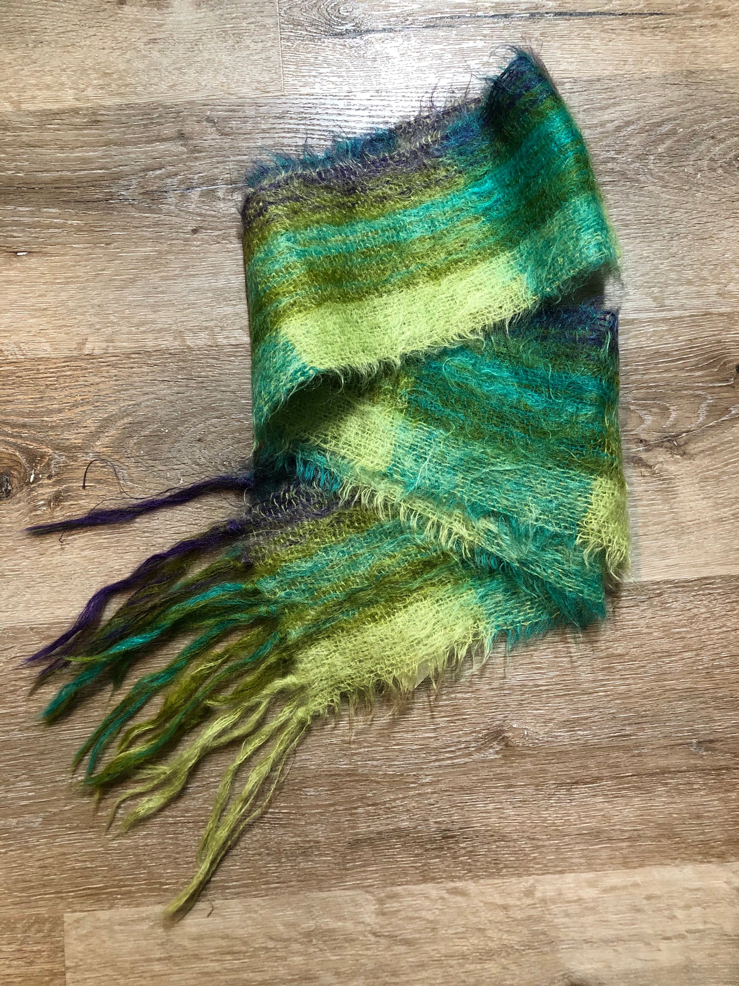 Kingspier Vintage - Handmade green, teal and purple plaid scarf.
Length - 70”
Width - 6”
Scarf is in excellent condition.