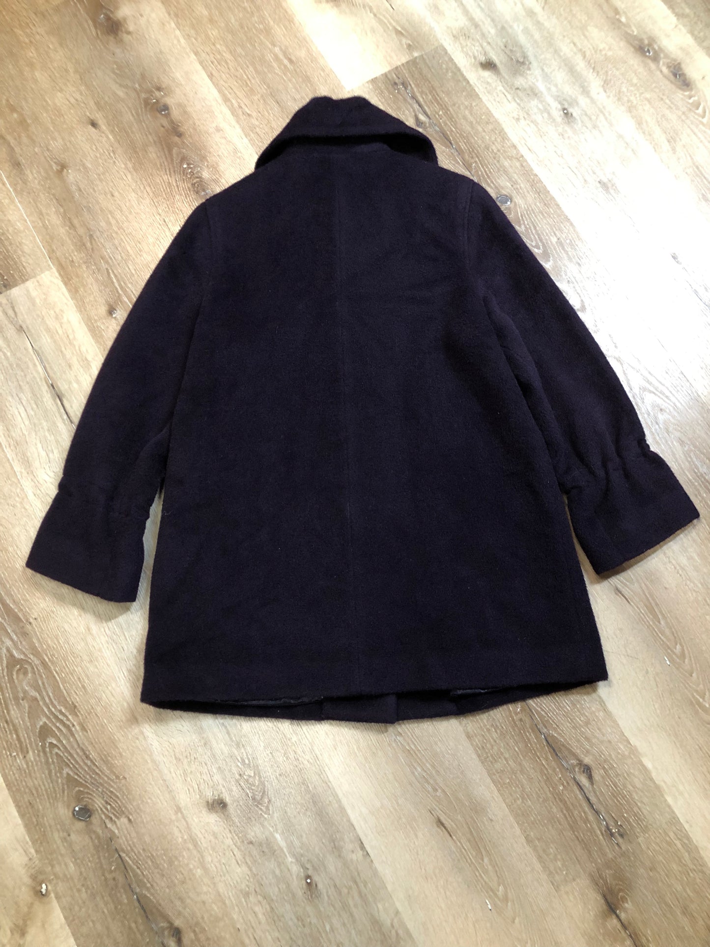 Kingspier Vintage - Vintage Me-Jay deep purple wool blend coat with large button closures, two front pockets and detail at the wrist. Shell is 65% wool/ 10% mohair and 5% alpaca.
Made in Canada.
Size 8.