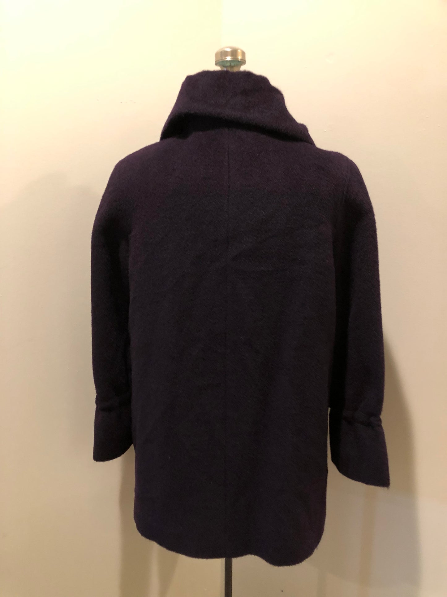 Kingspier Vintage - Vintage Me-Jay deep purple wool blend coat with large button closures, two front pockets and detail at the wrist. Shell is 65% wool/ 10% mohair and 5% alpaca.
Made in Canada.
Size 8.