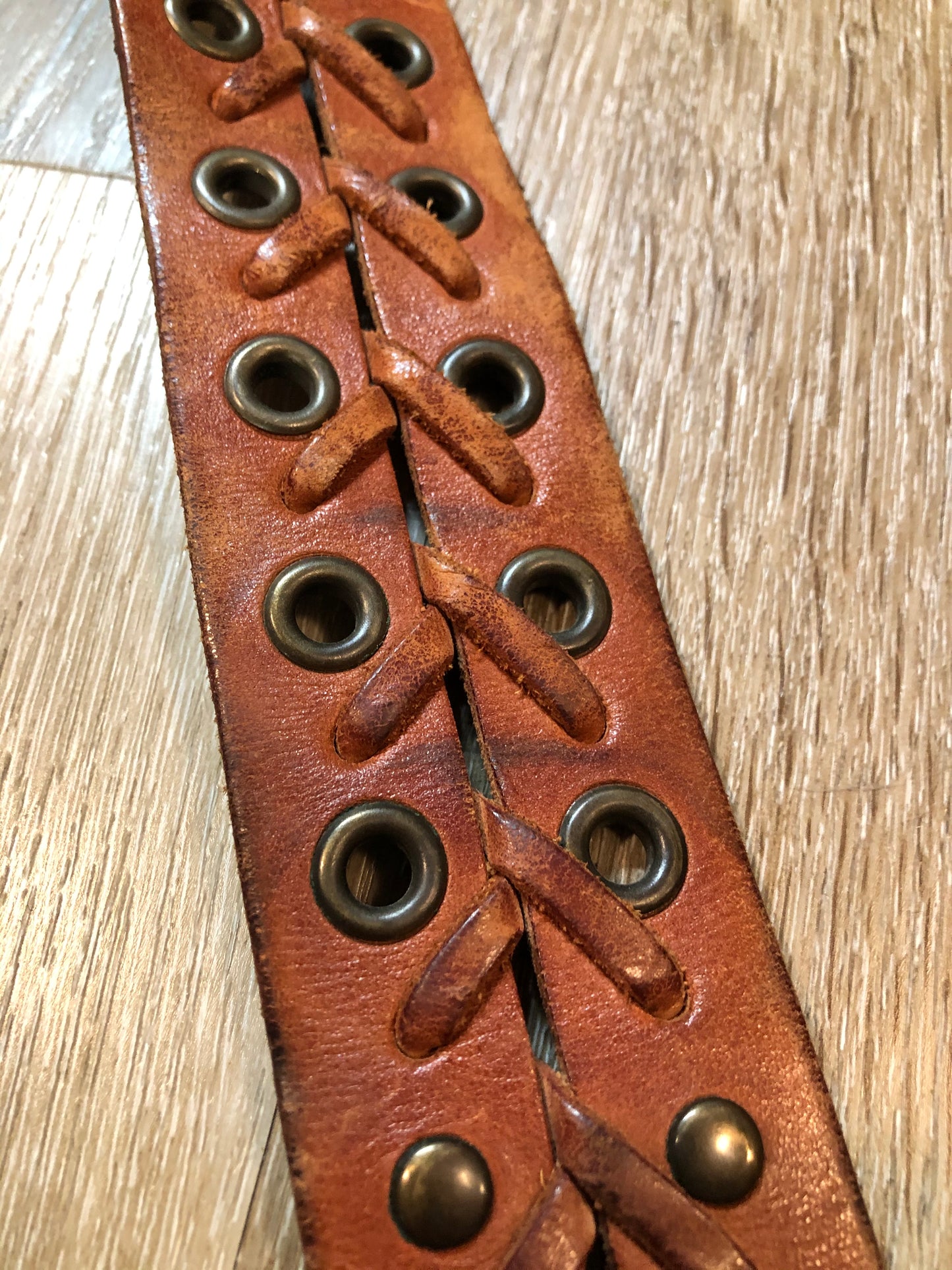 Kingspier Vintage - Brown leather belt with decorative leather stitching and brass circle buckle.