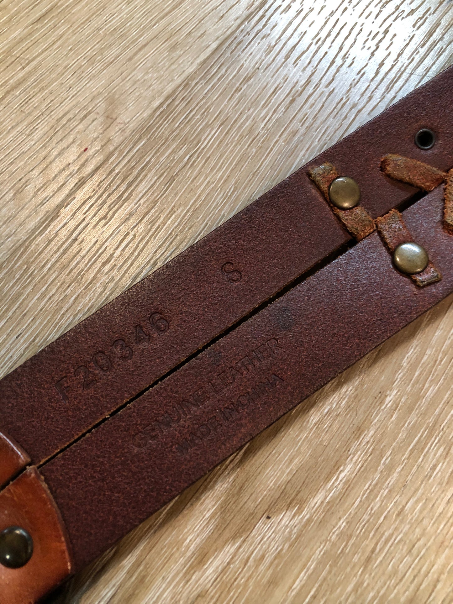 Kingspier Vintage - Brown leather belt with decorative leather stitching and brass circle buckle.
