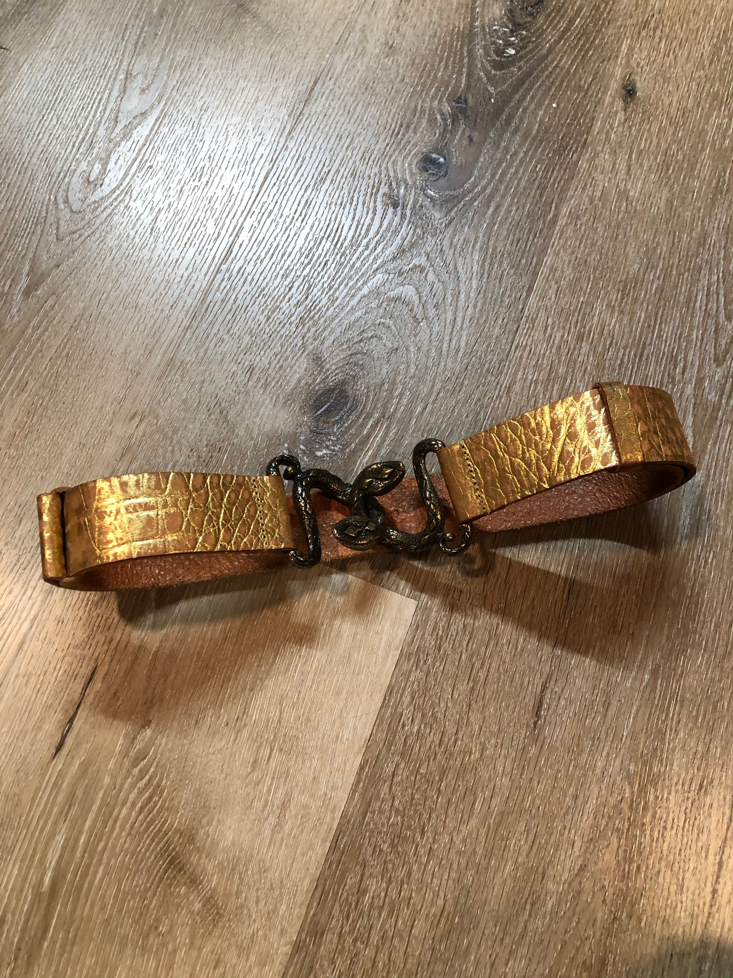 Kingspier Vintage - Gold croc-embossed leather belt with snake buckle closure.