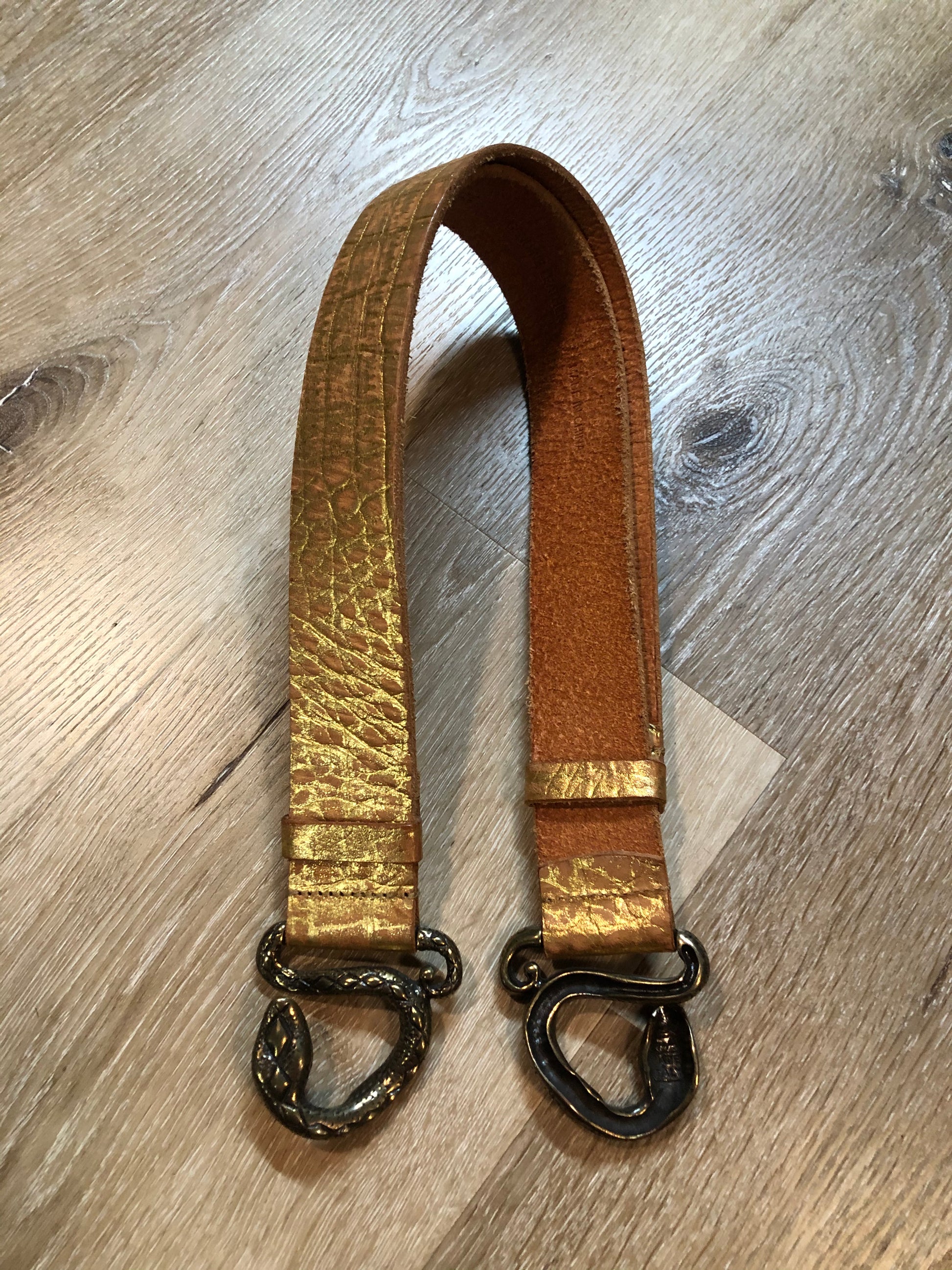Kingspier Vintage - Gold croc-embossed leather belt with snake buckle closure.
