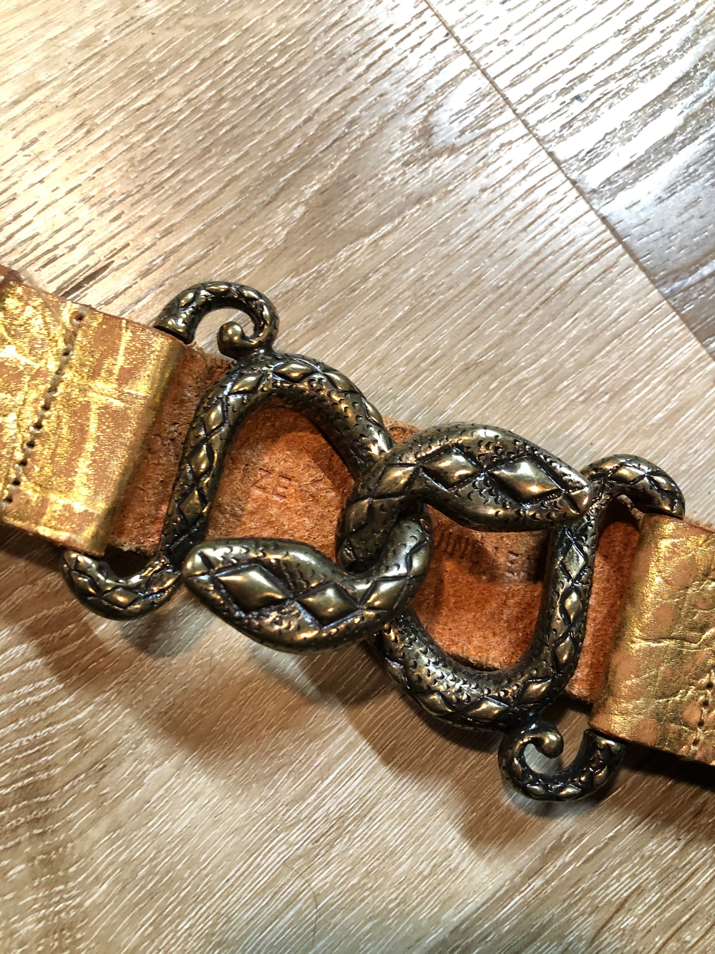 Kingspier Vintage - Gold croc-embossed leather belt with snake buckle closure.